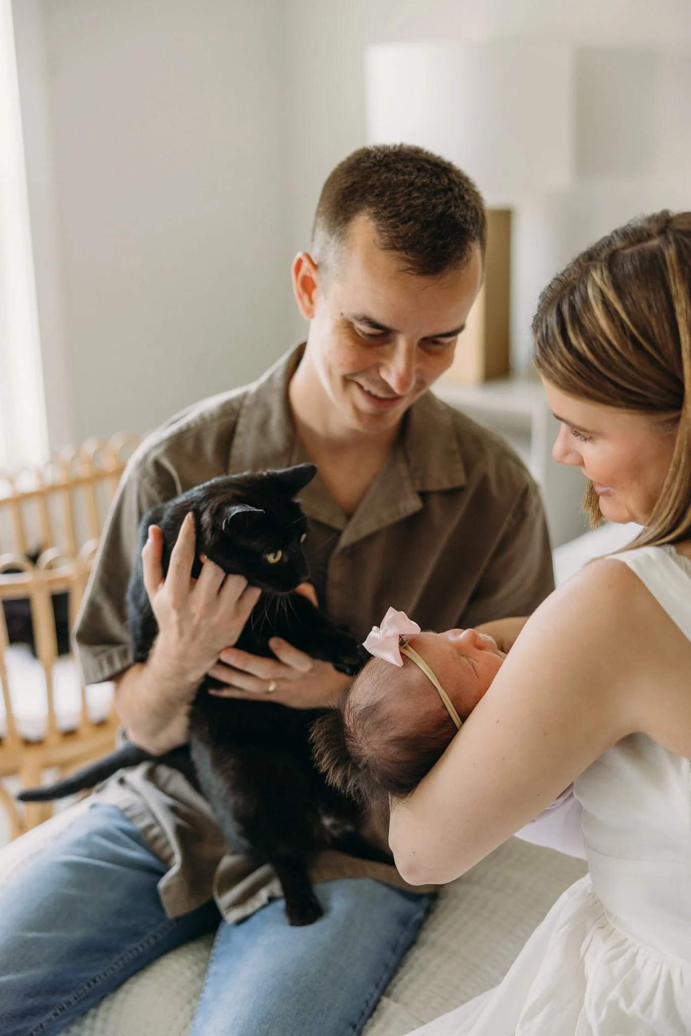 Cat near newborn baby during in-home lifestyle photography session, Nashville.