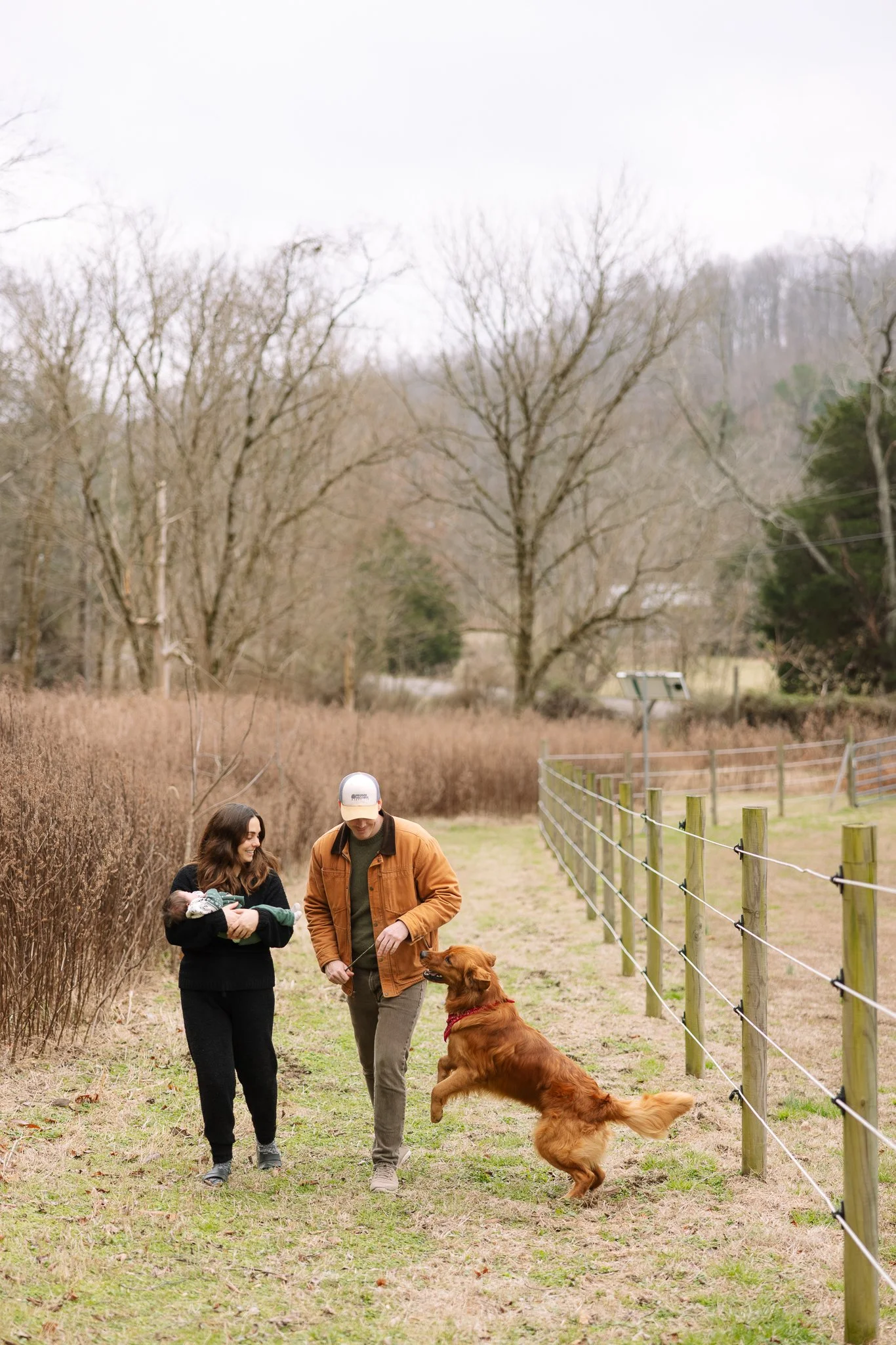 Family with dog and newborn baby, in-home lifestyle newborn photography Nashville TN.
