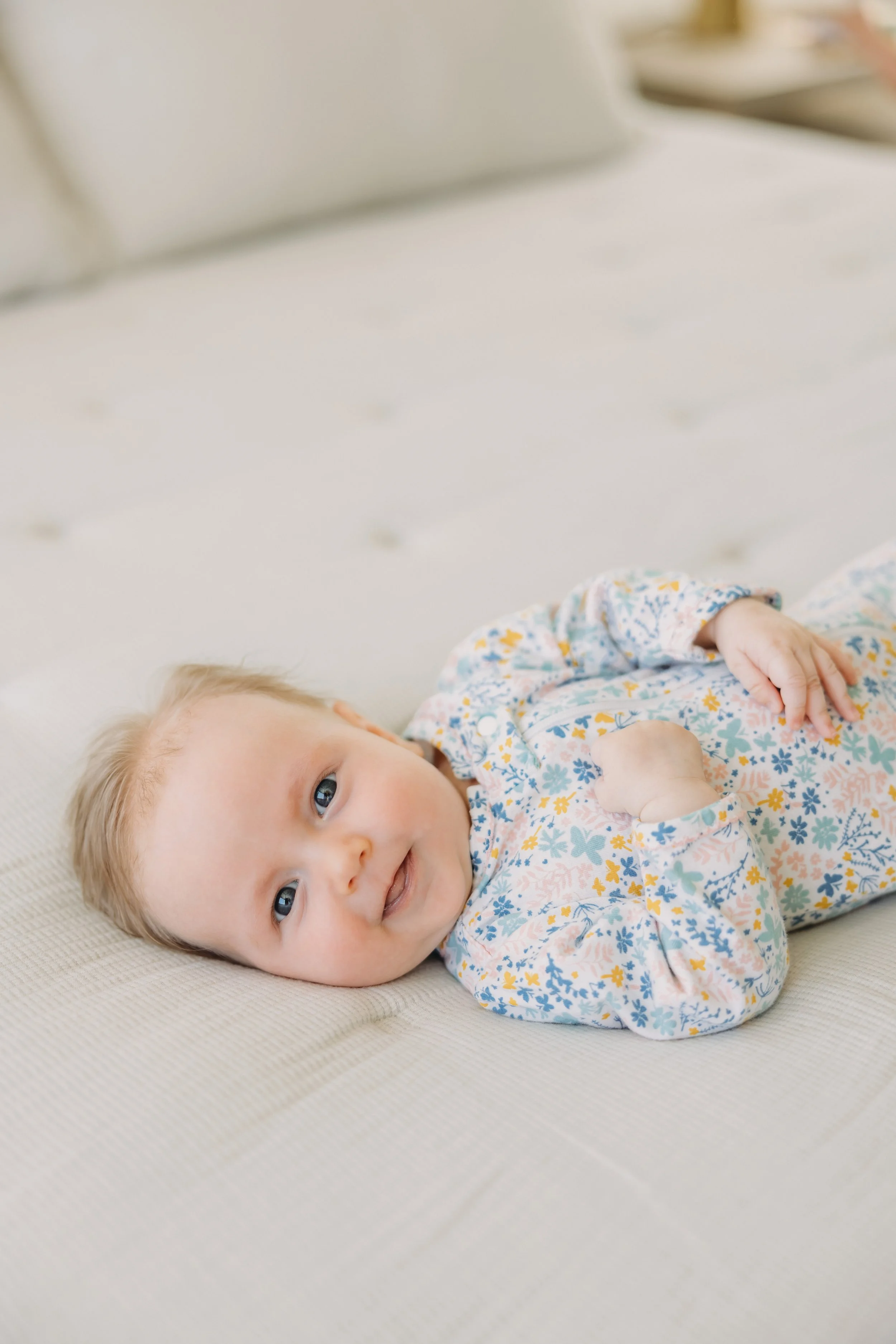 Awake newborn looking toward camera during an in-home photography session in Nashville