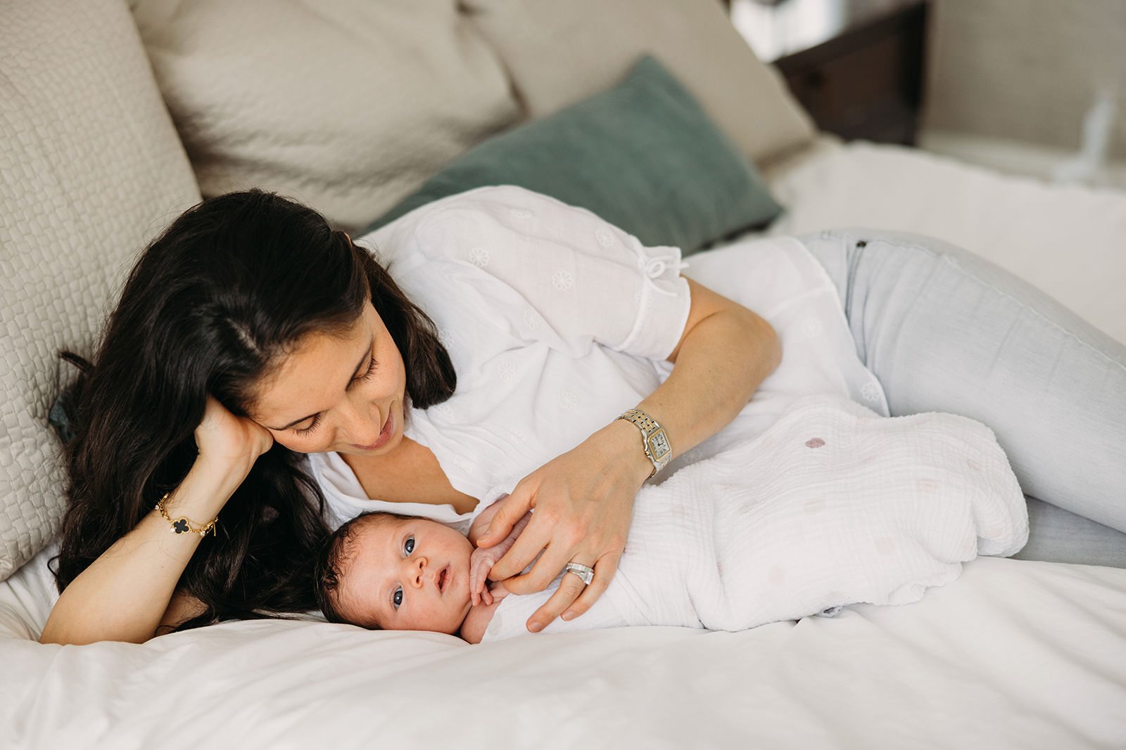 Mom and newborn baby in Nashville bedroom at home