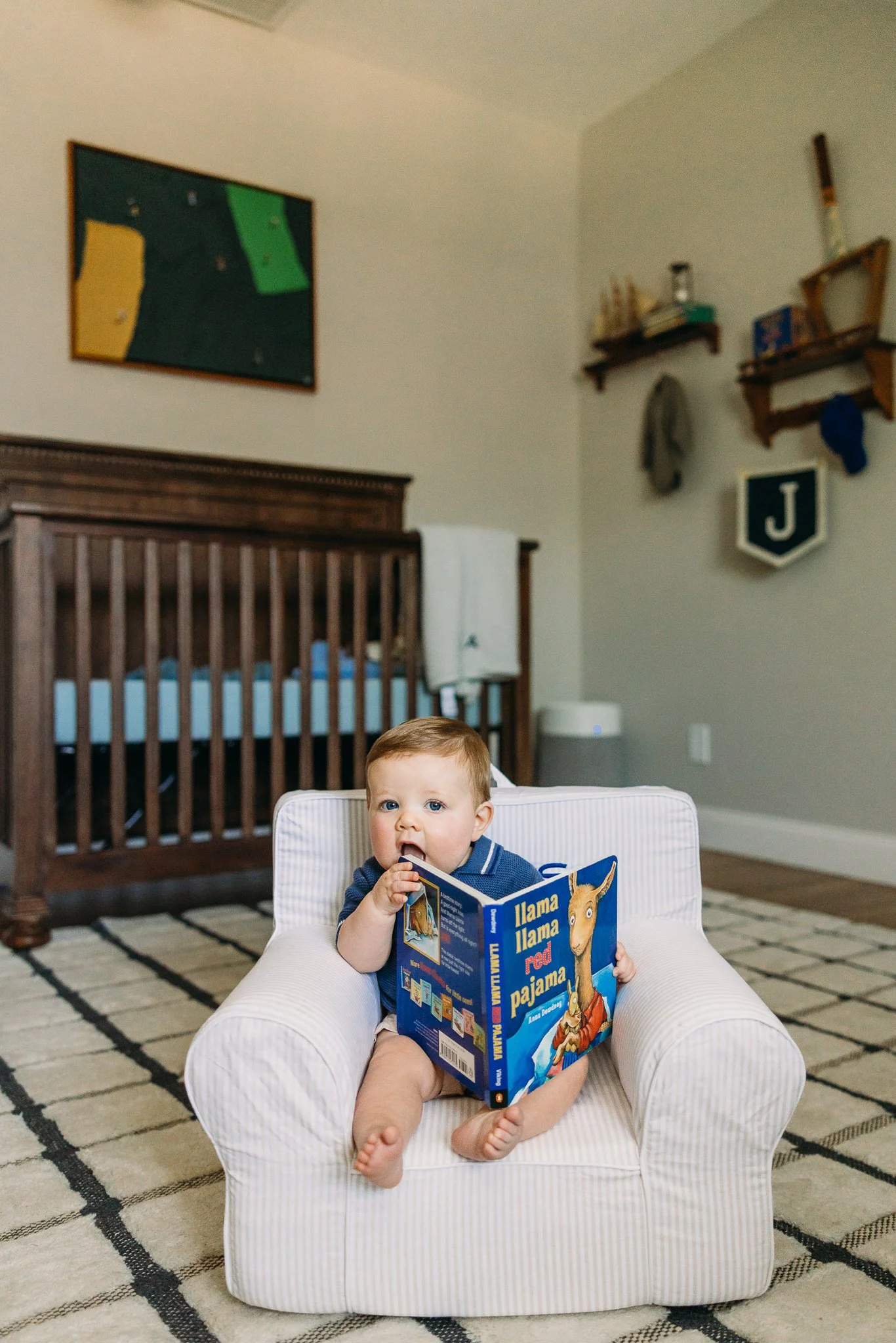 Sitting baby photo shoot at home baby reading a board book