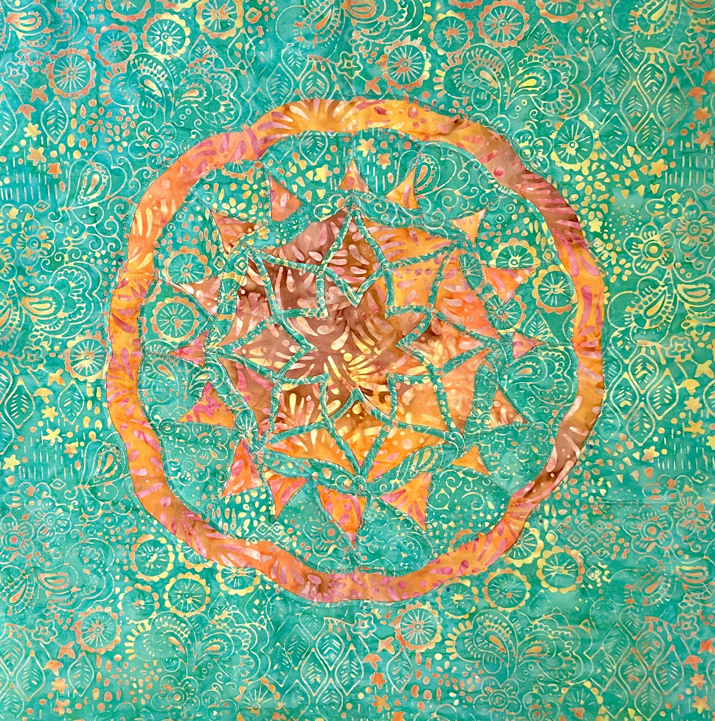 From a class I took on ruler work and reverse appliqué.