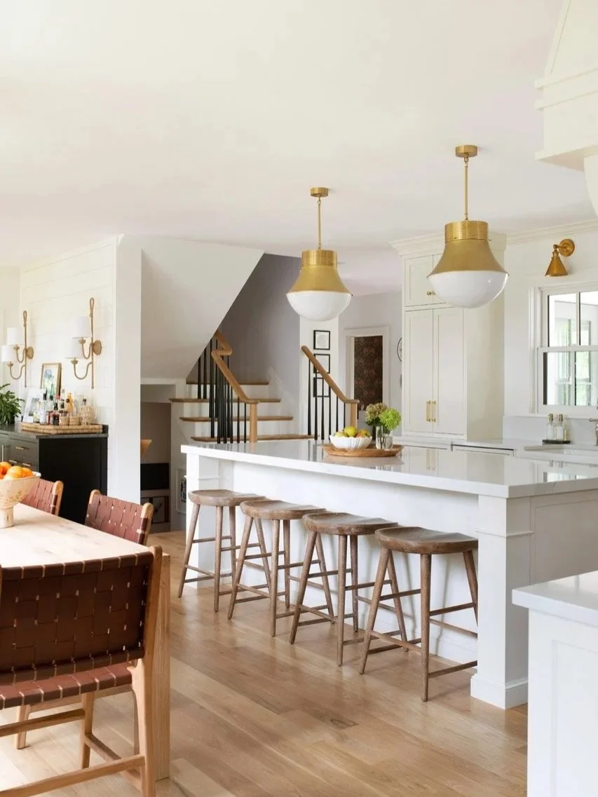 One of our favorite spaces in the house☕️🏠

This kitchen was designed to feel bright, warm, and lived-in from day one. The oversized island, natural white oak floors, layered brass lighting, and mix of textures all work together to make the space fe