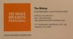 Business card for Tim Biskup, Vice President, Solution Delivery, with contact information and business address.