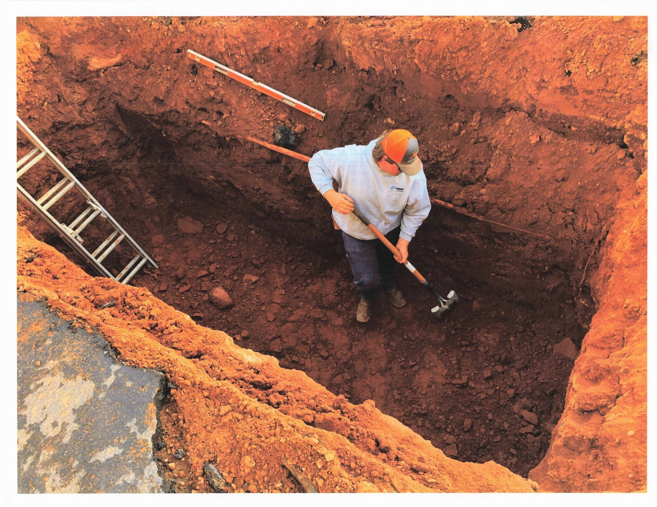 Oranssi technician working on a roof project