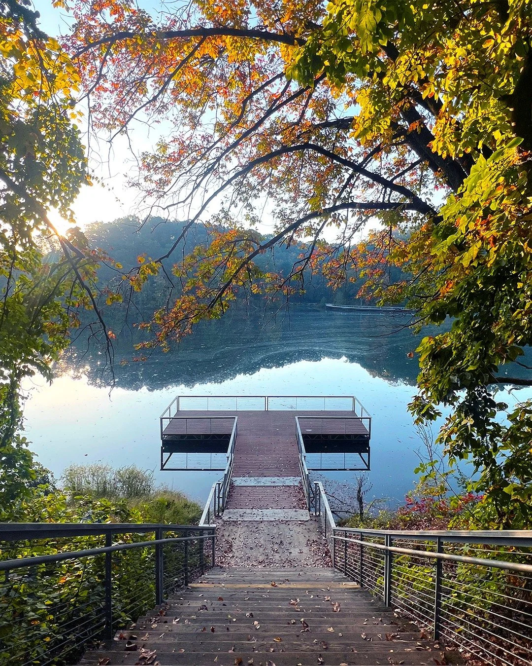Lake Atalanta
Rogers, Arkansas
36.3380&deg; N, 94.0982&deg; W

I found myself standing on that wooden deck, framed by early-morning light and the soft hush of the Ozark foothills. In front of me, early morning joggers and folks walkng their dogs circ