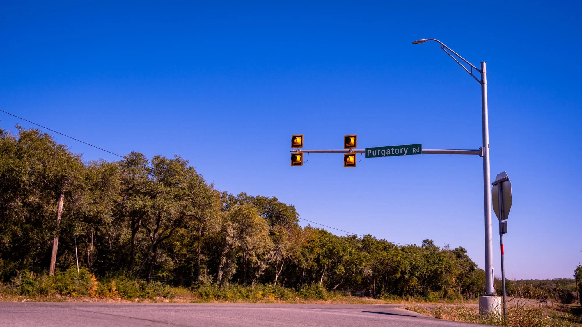 Purgatory Road
Texas Hill Country
29&deg;50'18.6"N, 98&deg;09'27.4"W

Purgatory Road cuts through the limestone terrain of the Texas Hill Country, a region shaped over millions of years by uplift, erosion, and water. The area sits at the ed