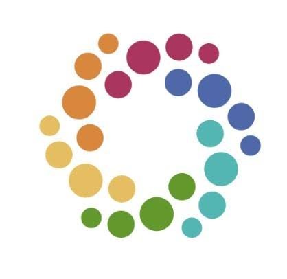 Colorful circular pattern forming a ring with various sized dots in multiple colors, including yellow, orange, red, blue, green, and purple.