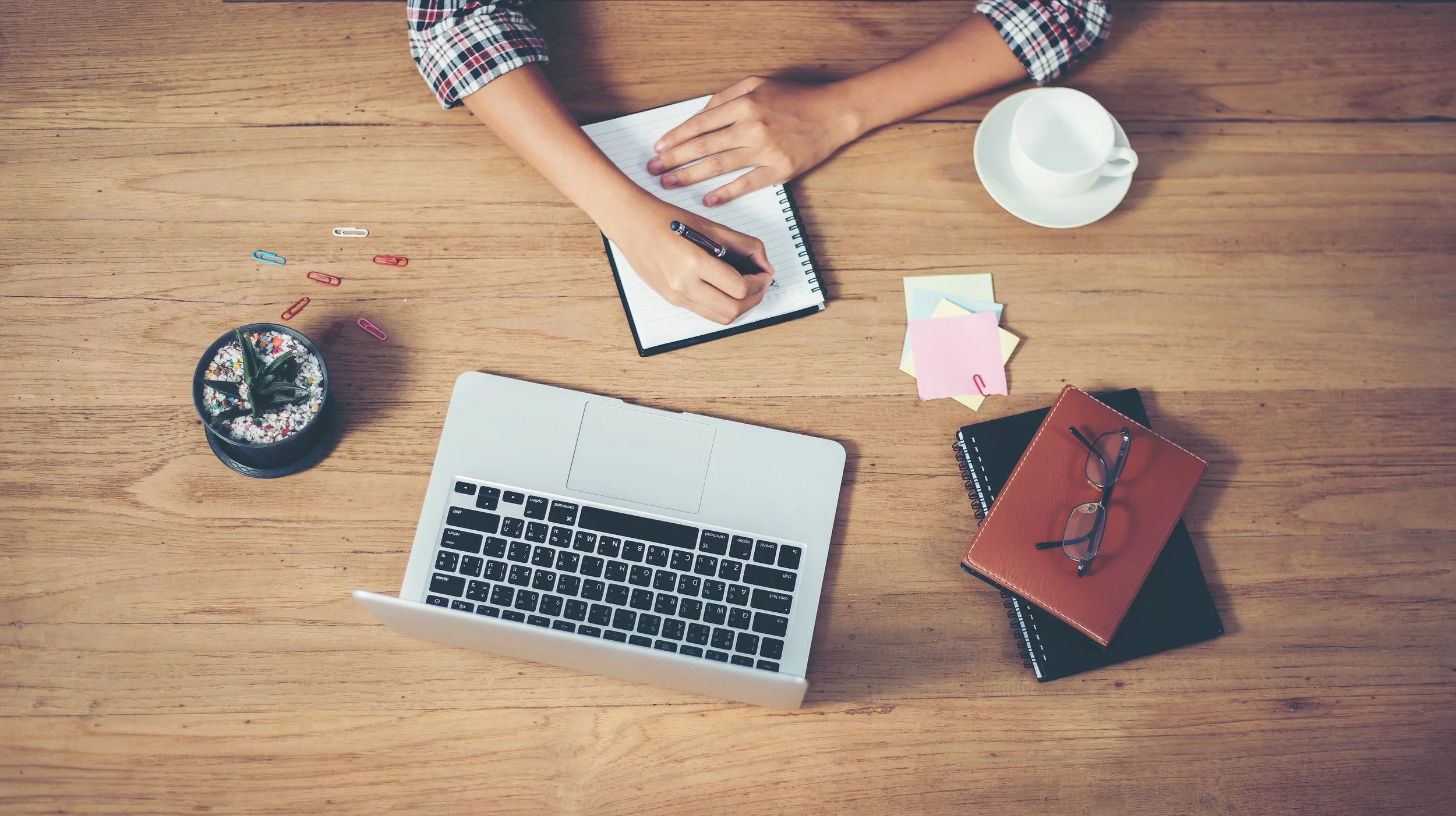 vecteezy_top-view-of-hipster-woman-hands-writing-on-notebook_3146238.jpg
