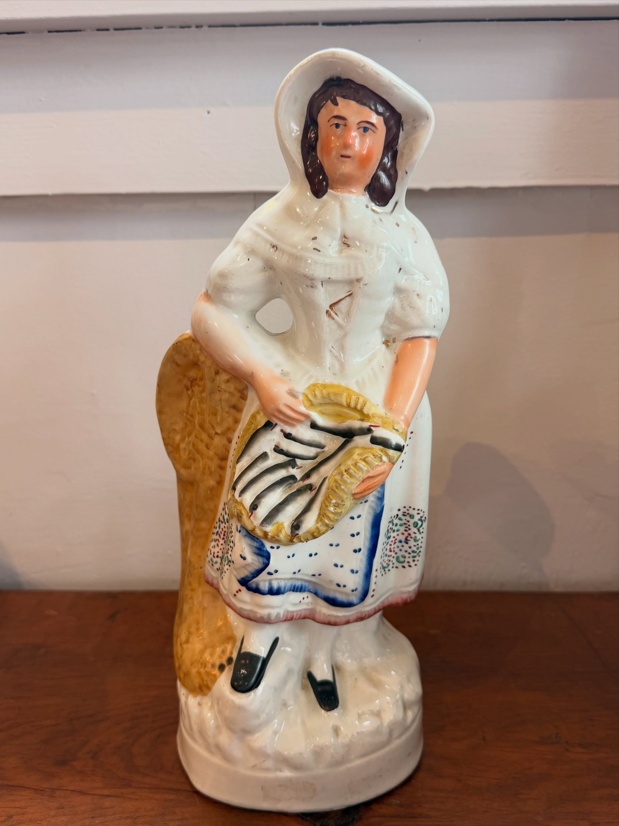 Mid 19th century English Staffordshire figure of a lady with basket of fish.
13.25&rdquo; high
$161

Call 215-798-6970 or stop in to purchase.
All sales are final.
#englishstafford #staffordshire #antiques #antiquestaffordshire #consignment