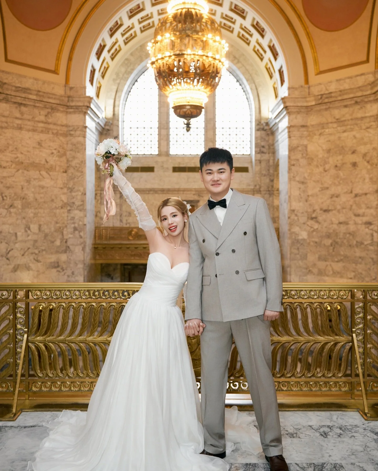 Beneath Olympia&rsquo;s golden dome,
light fell softly on their smiles and joined hands 
marble halls quiet until love began to move through them. ✨
A ceremony made of slow breath, warm laughter,
and two quiet heartbeats becoming one.

📍 Olympia Sta