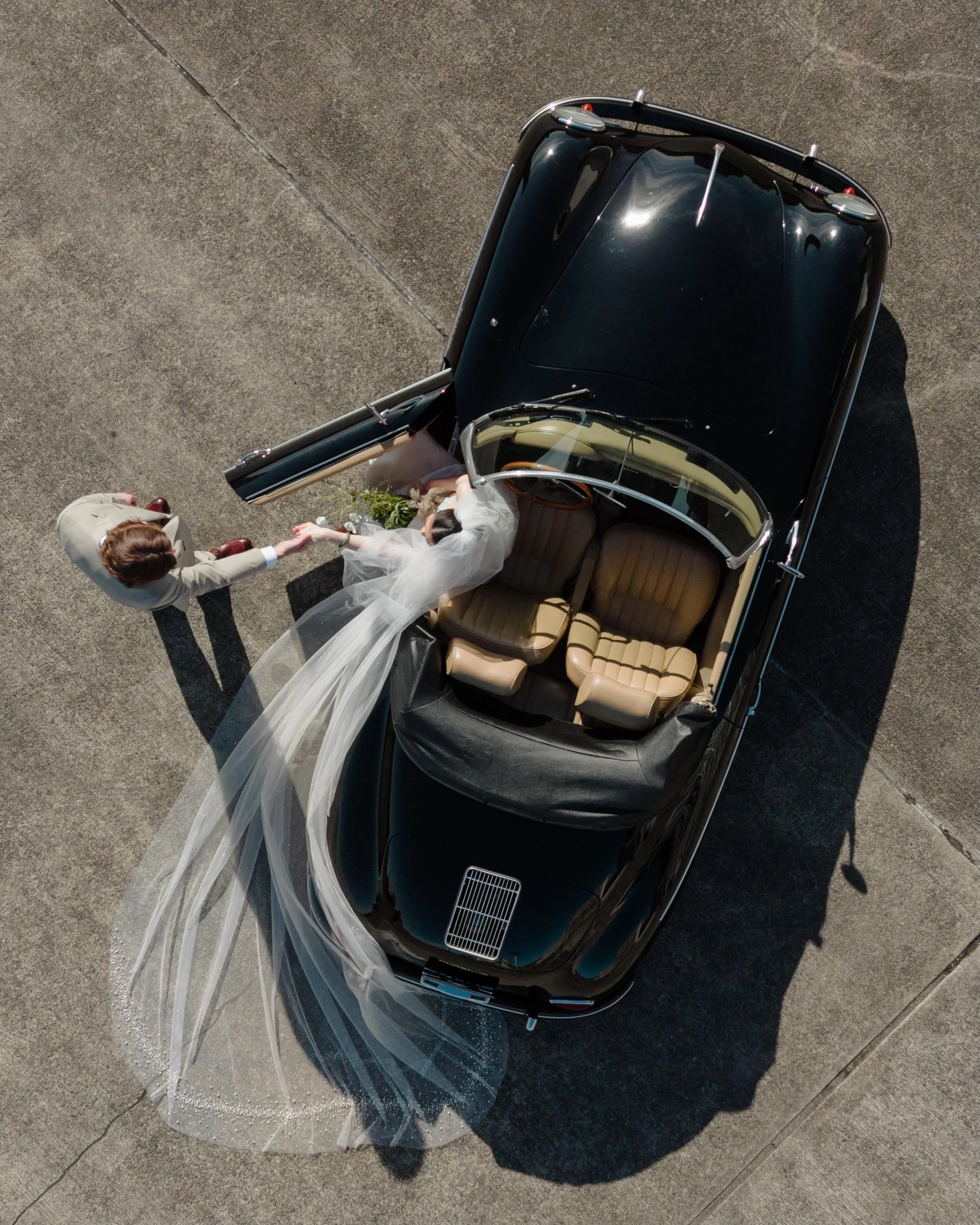 Modern love story, with a vintage soul. 🎬🖤

A vintage black convertible, a flying veil, and a love story that feels completely effortless. 

There is something so incredibly romantic about taking a classic Porsche 356 out onto the Seattle streets. 