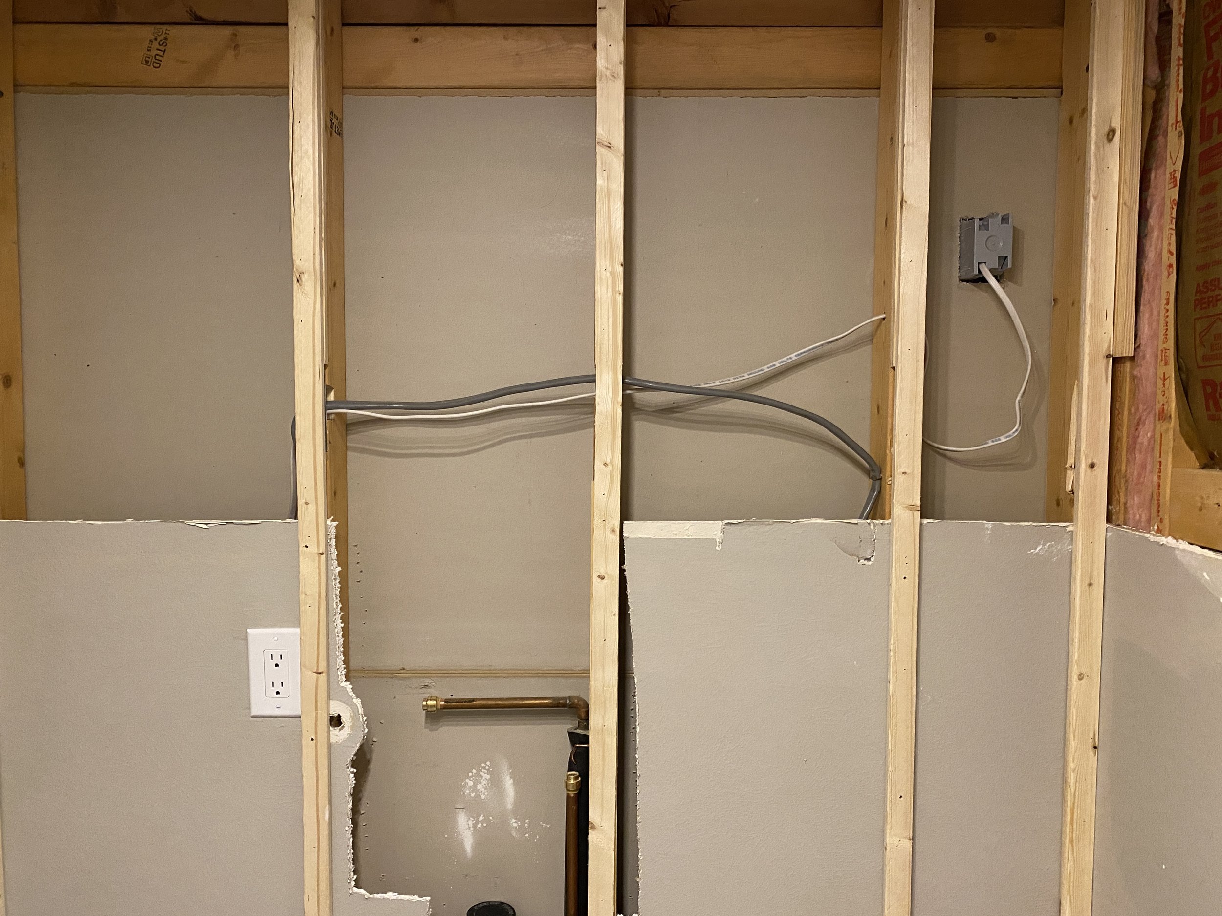 Oh, and I was able to add an outlet (upper right corner) to the bookcase in my office (which is on the opposite side of this wall)--might as well do it while I had the chance, I figured! Now I can easily add LED lighting to my office bookcase.