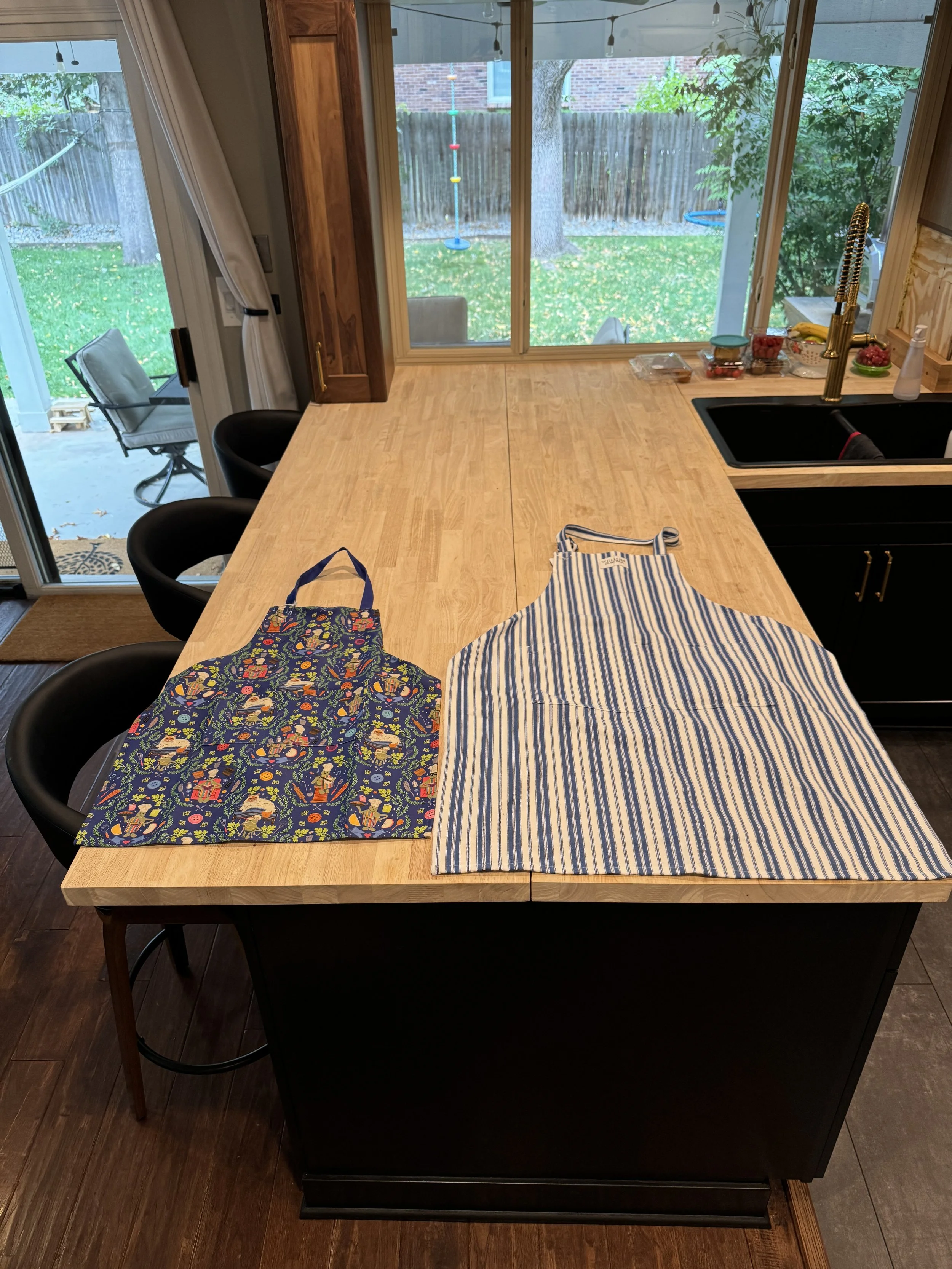 I bought my daughter and myself a couple of aprons, so that we could cook our first meal together using the new range (her Mom was out of town for work).
