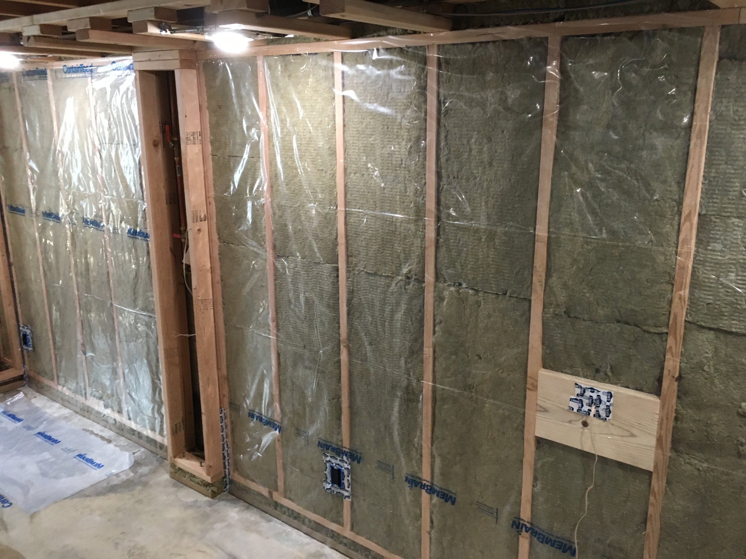 MemBrain vapor barrier installation... lots of cutting and stapling for me.