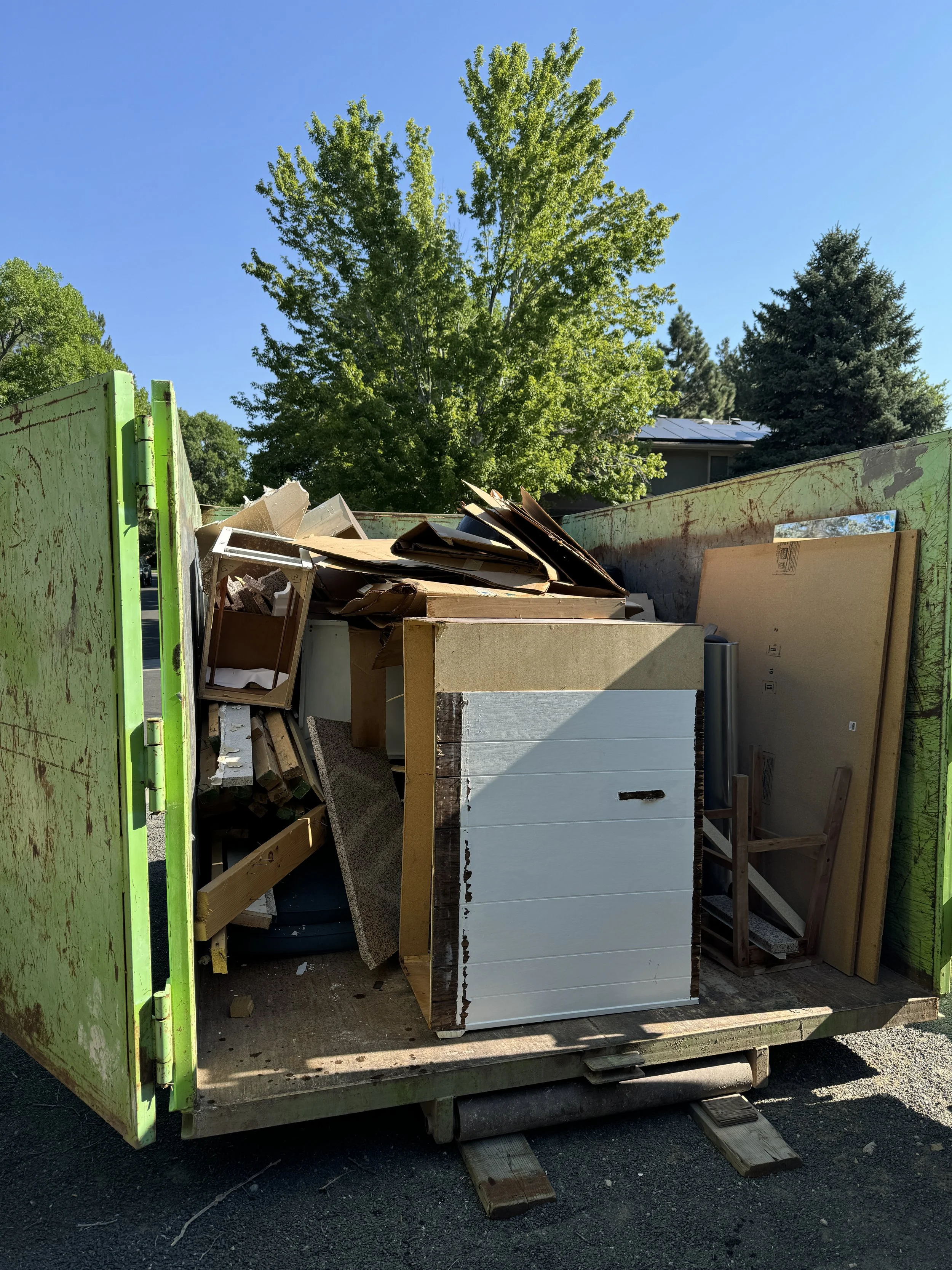 There's our old kitchen, in the dumpster!  Breaking up the granite with a sledgehammer was really fun, but that stuff is HEAVY!  