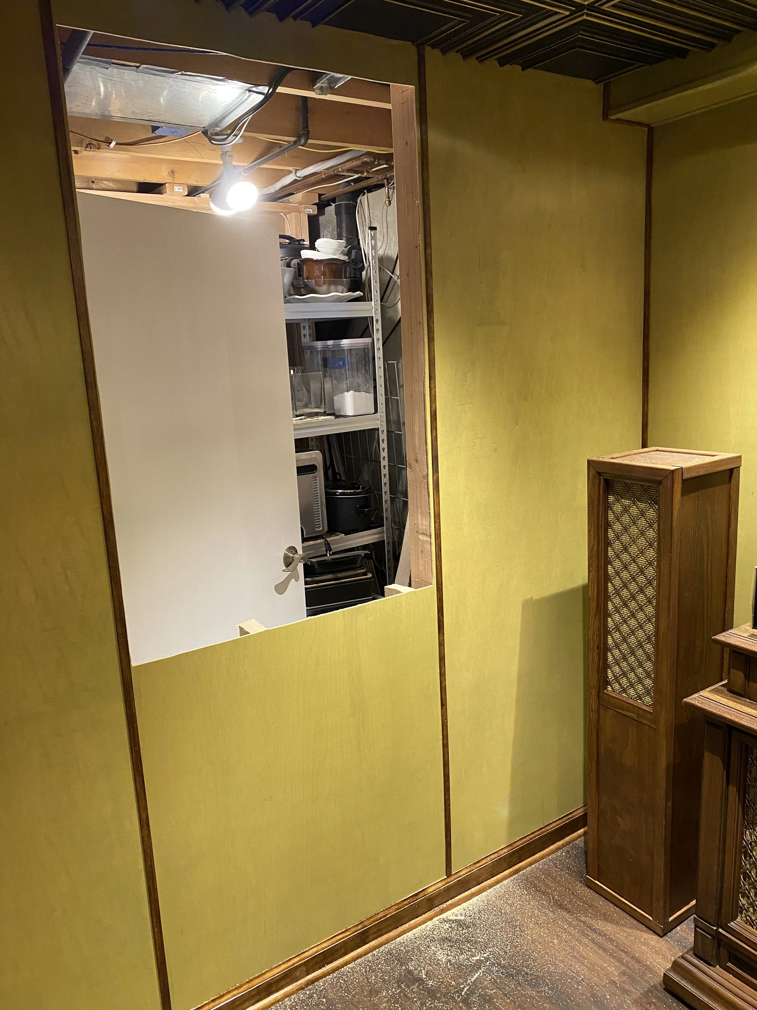 Cut a hole in the wall, basically the same size as the bar (just ever-so-slightly bigger).