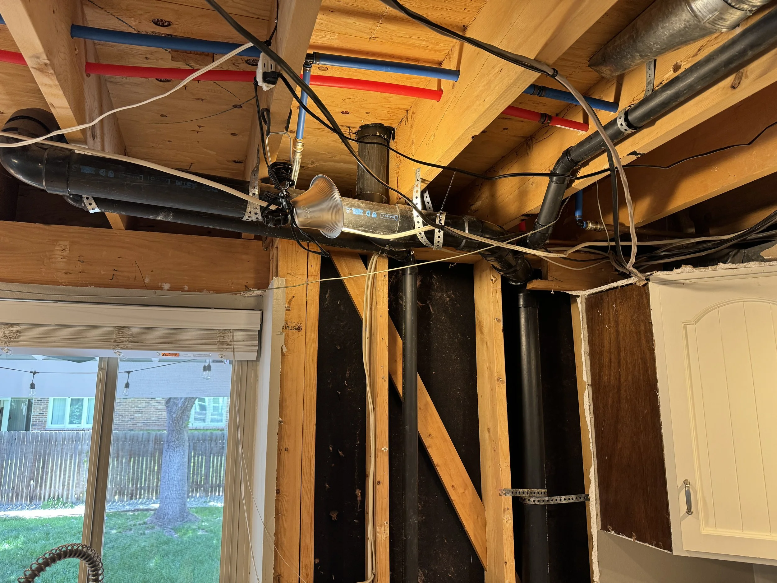 Now... the drain & vent lines. These are from Lily's bathroom (toilet, sink, and bathtub). The only solution is to re-route them to the exterior, then reconnect to the main drain stack in the wall. Time to get started!