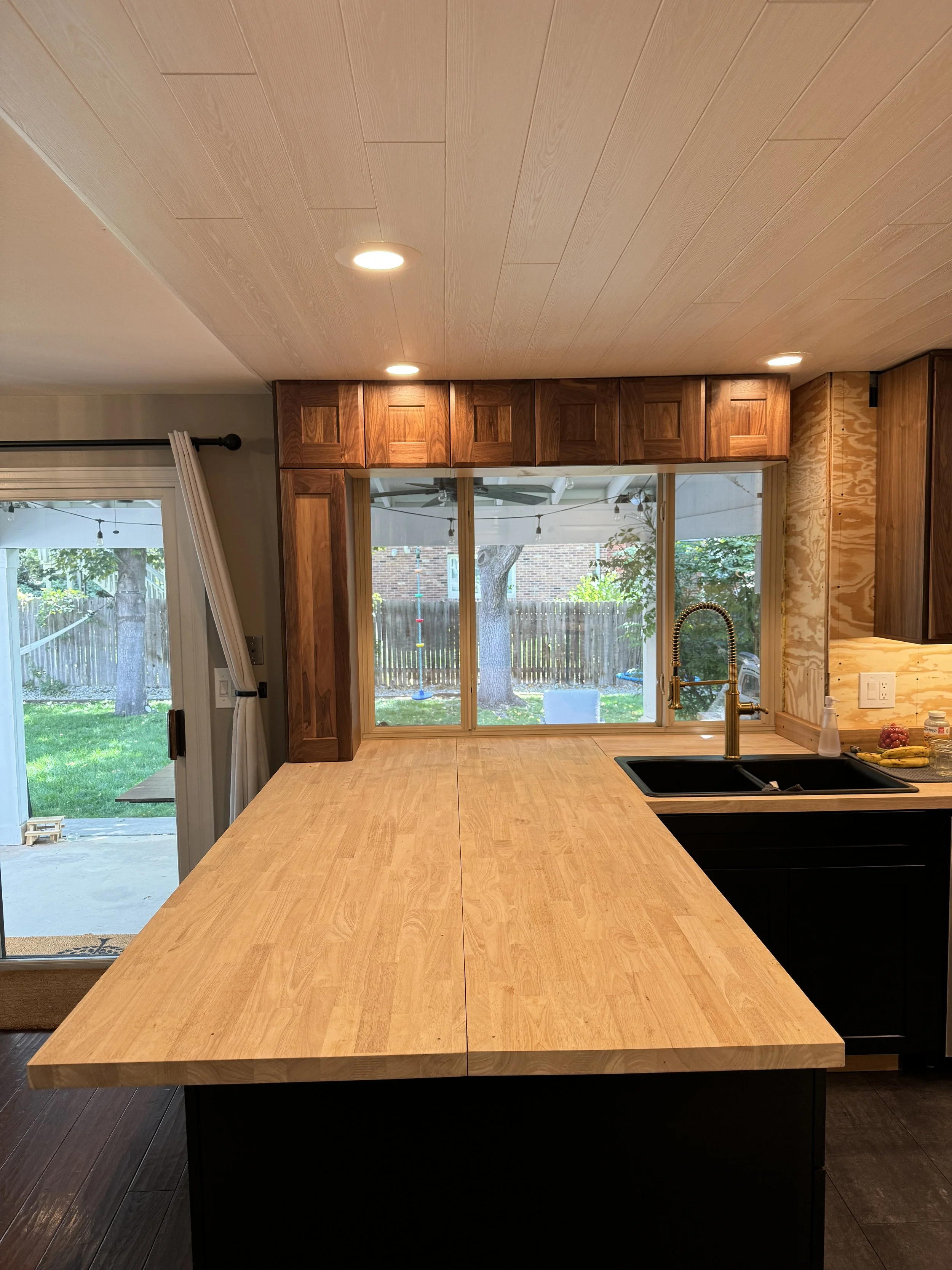 Finished, but... after this, I decided to put spacers between each cabinet, so that the whole row ended at the wall.  So, I had to take these down and re-do them.  I forgot to take photos of that, though.  Oh well.