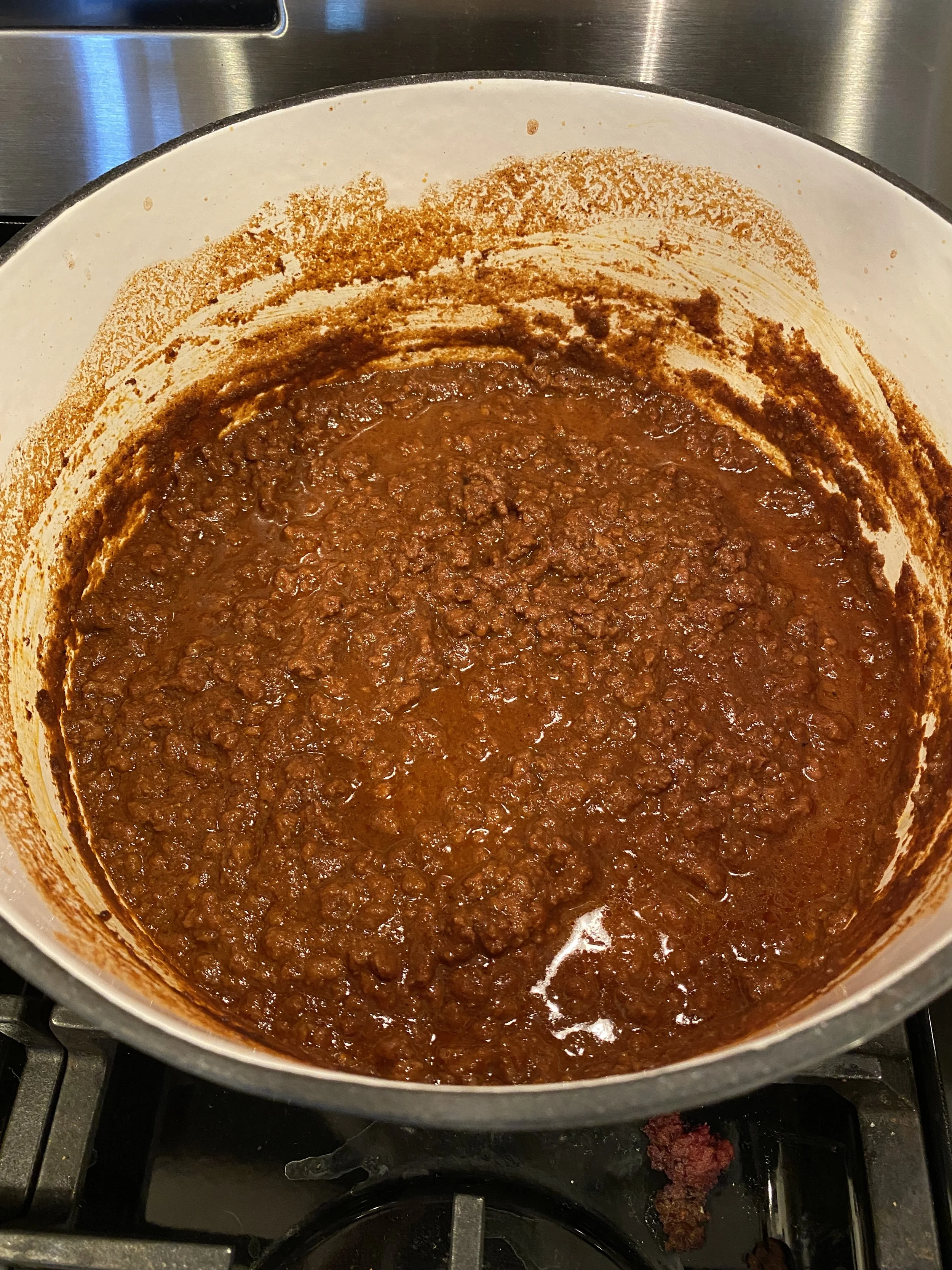 Cincinnati chili--my absolute FAVORITE type of chili.  I know it's a polarizing dish, and some people don't care for it at ALL... but I love it.  And this copycat Skyline chili recipe is the best of many that I have tried!  It doesn't look like much 