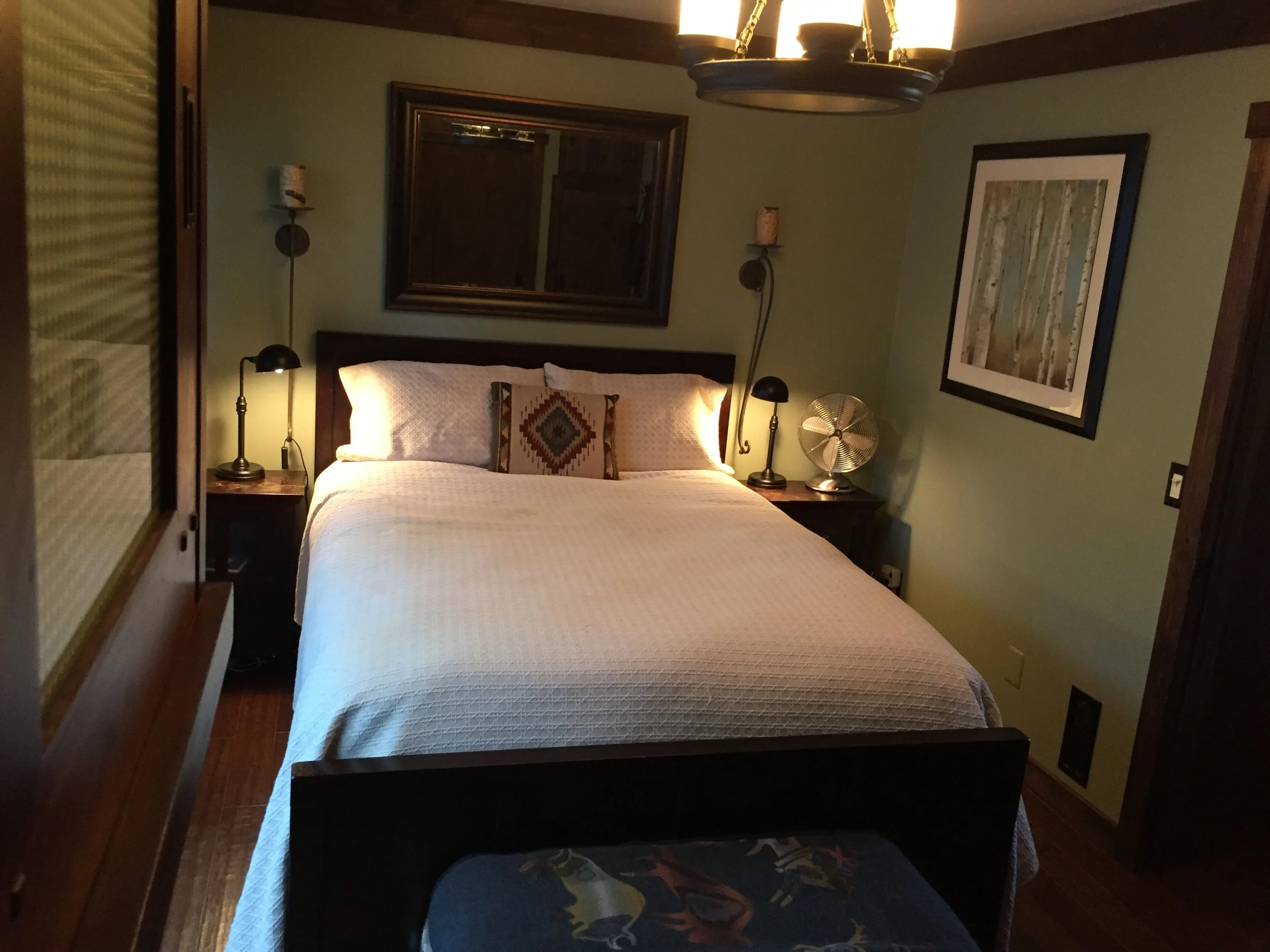 Bedroom after.  Just some fresh paint, sconces, nightstands, and art.  It made such a difference, though!