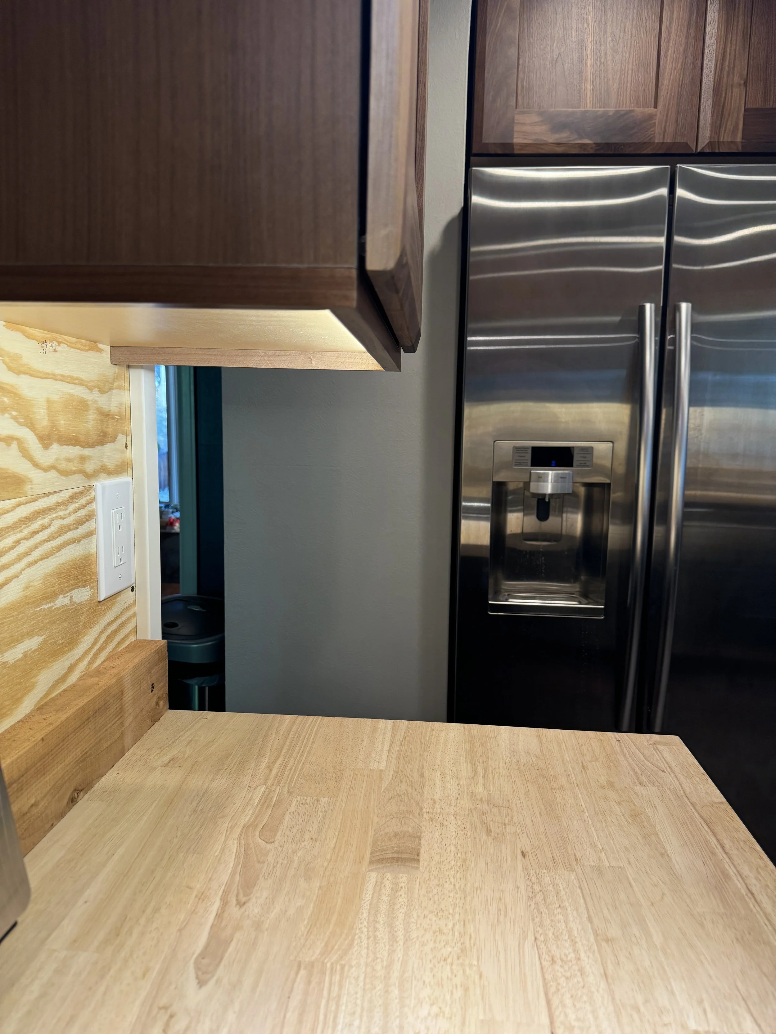 I installed the undercabinet lighting once these wall cabinets were up--connected to a dimmer switch on the wall.  Love it!