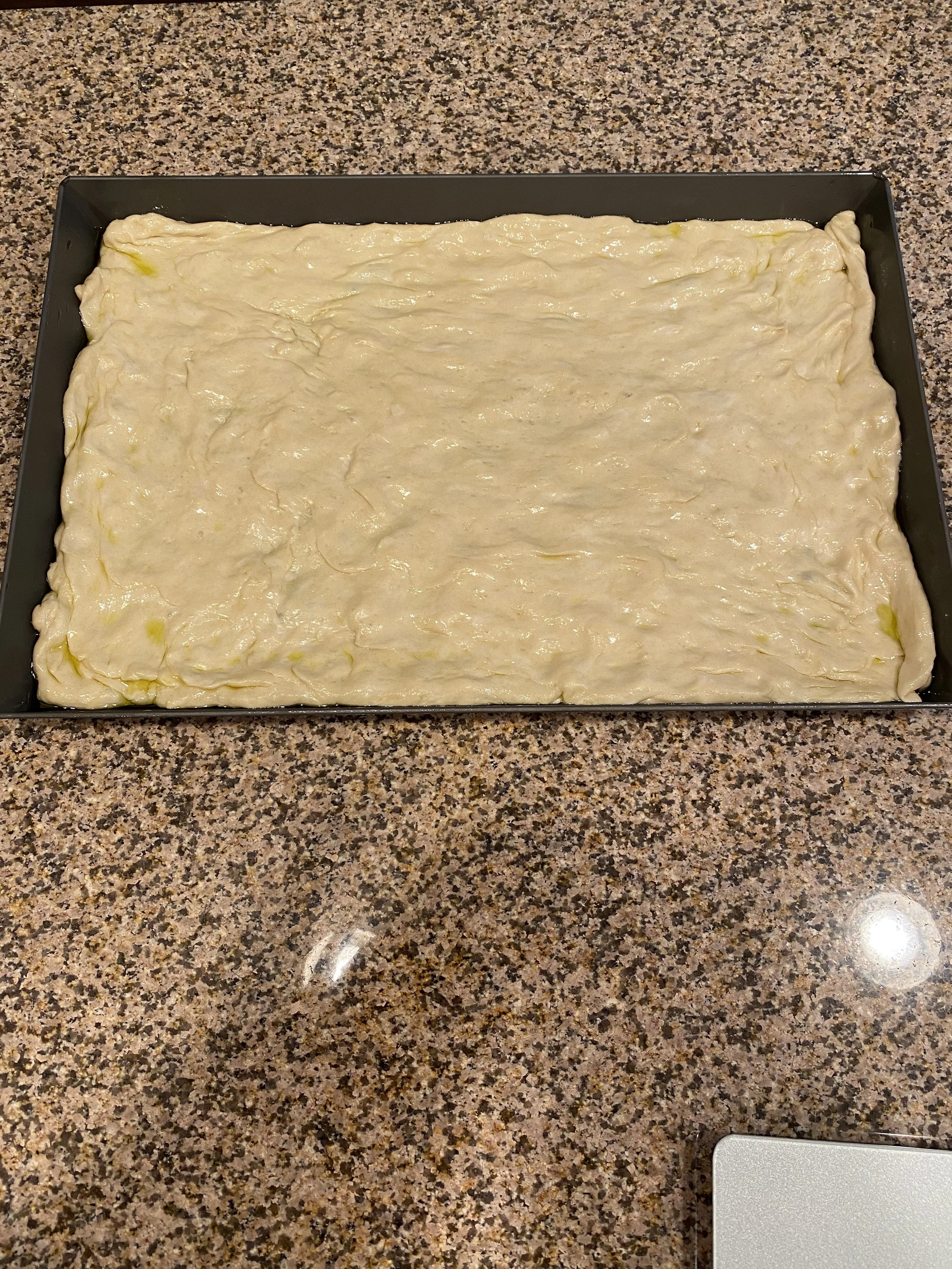 And this is the Sicilian pizza--I don't have many photos of making it, but the next steps are layers of sliced mozzarella cheese, homemade spicy tomato sauce, toppings, and a sprinkling of grated romano.  This has turned out to be one of my favorite 