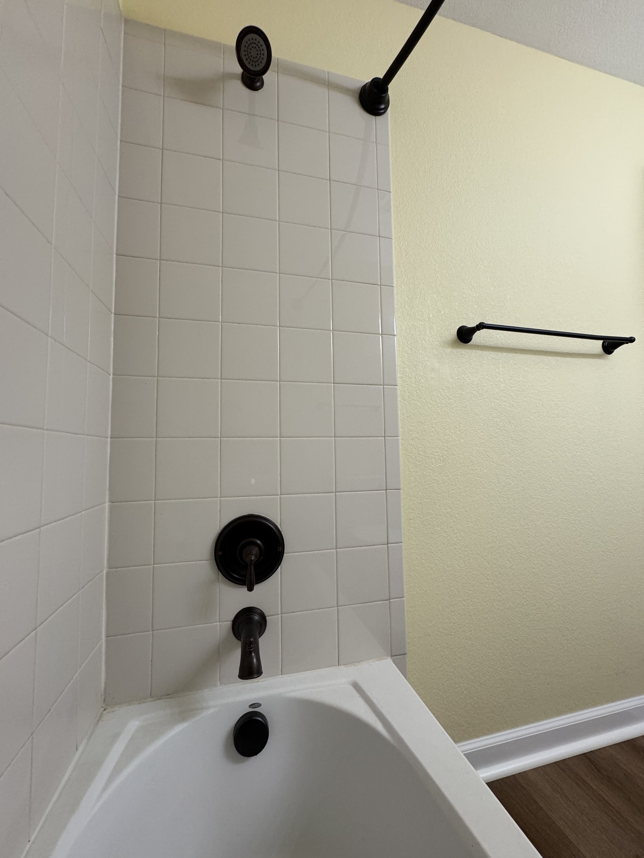 …Done!  It looks SO MUCH better--and it functions better, too!  The new shower head pressure BLOWS AWAY the old one.  :)