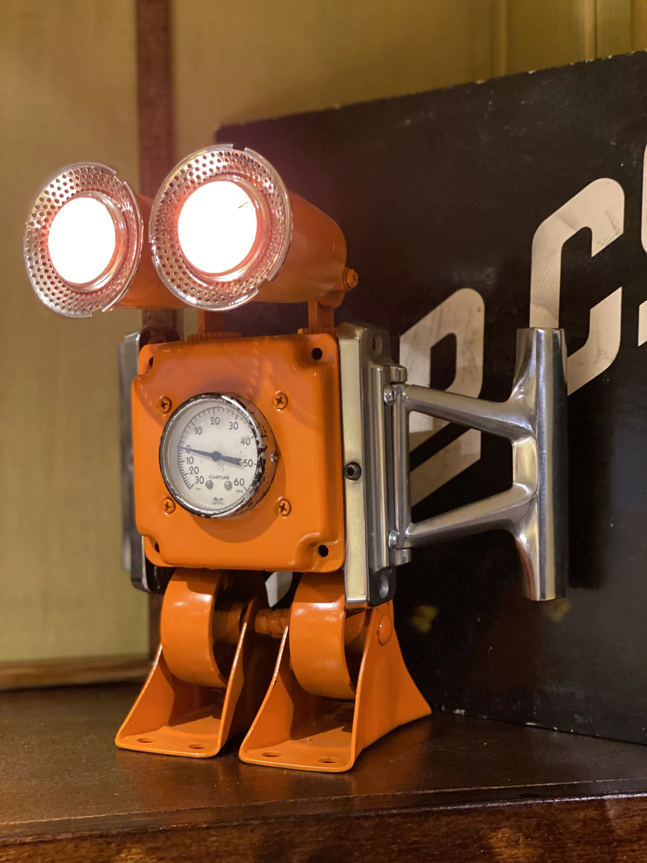Just a fun robot sculpture that I bought at an art show in Boulder… I love the orange, and in my opinion he’s got some personality to him!  :)