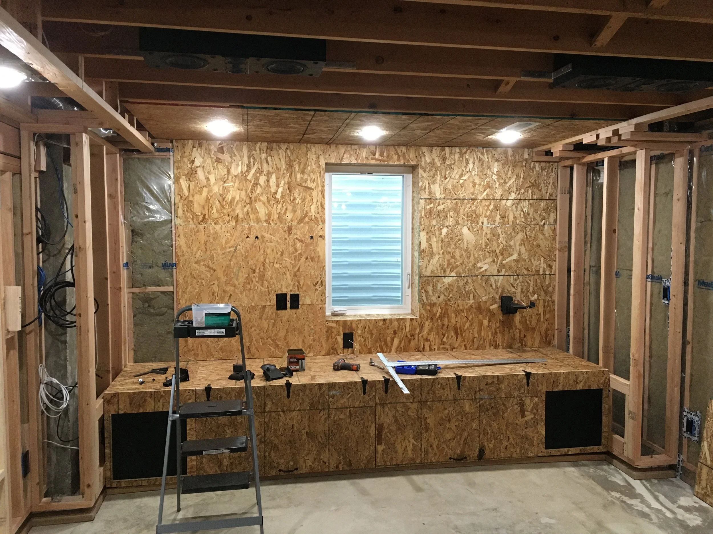 Starting on the OSB sheathing installation... I saw this being used in a modern home in an issue of Dwell magazine, and I thought it looked so cool--plus it would be easy for one person to work with/install (using 2' x 4' sheets). 