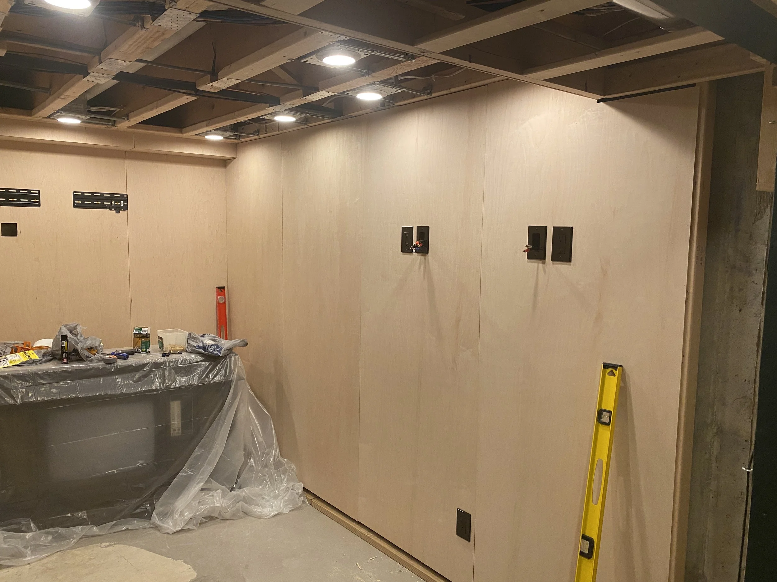 Next was maple finished plywood on the walls, along with wiring the lights, electrical, and all of the audio/video components.