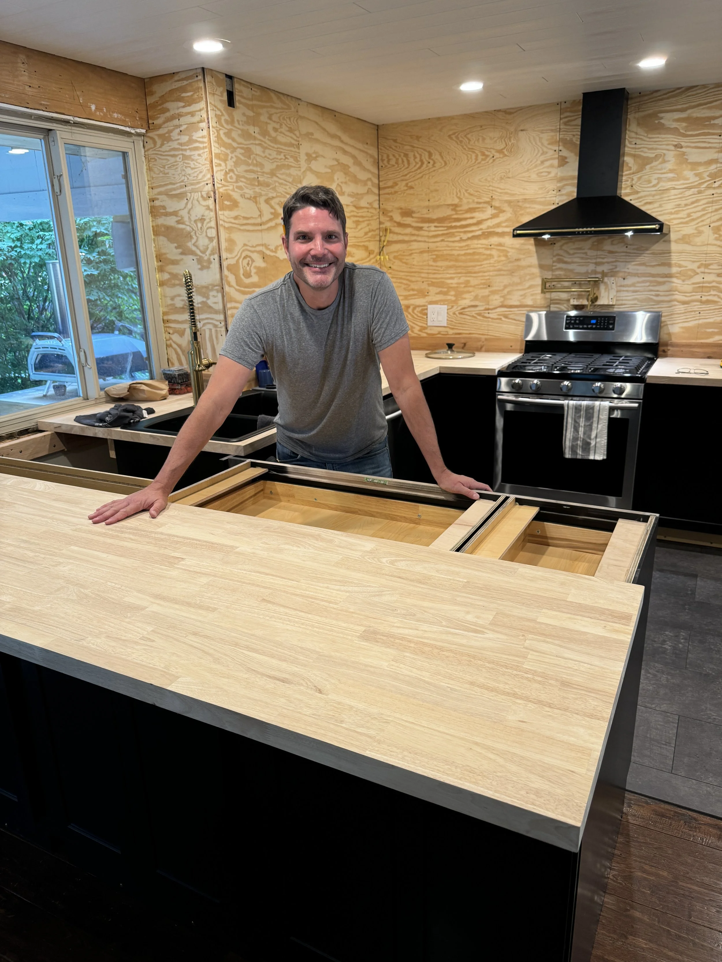 Adding the temporary countertops--butcher block was on sale at Lowe's, and it worked out that it would only be about $50 more to have these countertops rather than plywood for 6 weeks.  It was money well spent.  :)