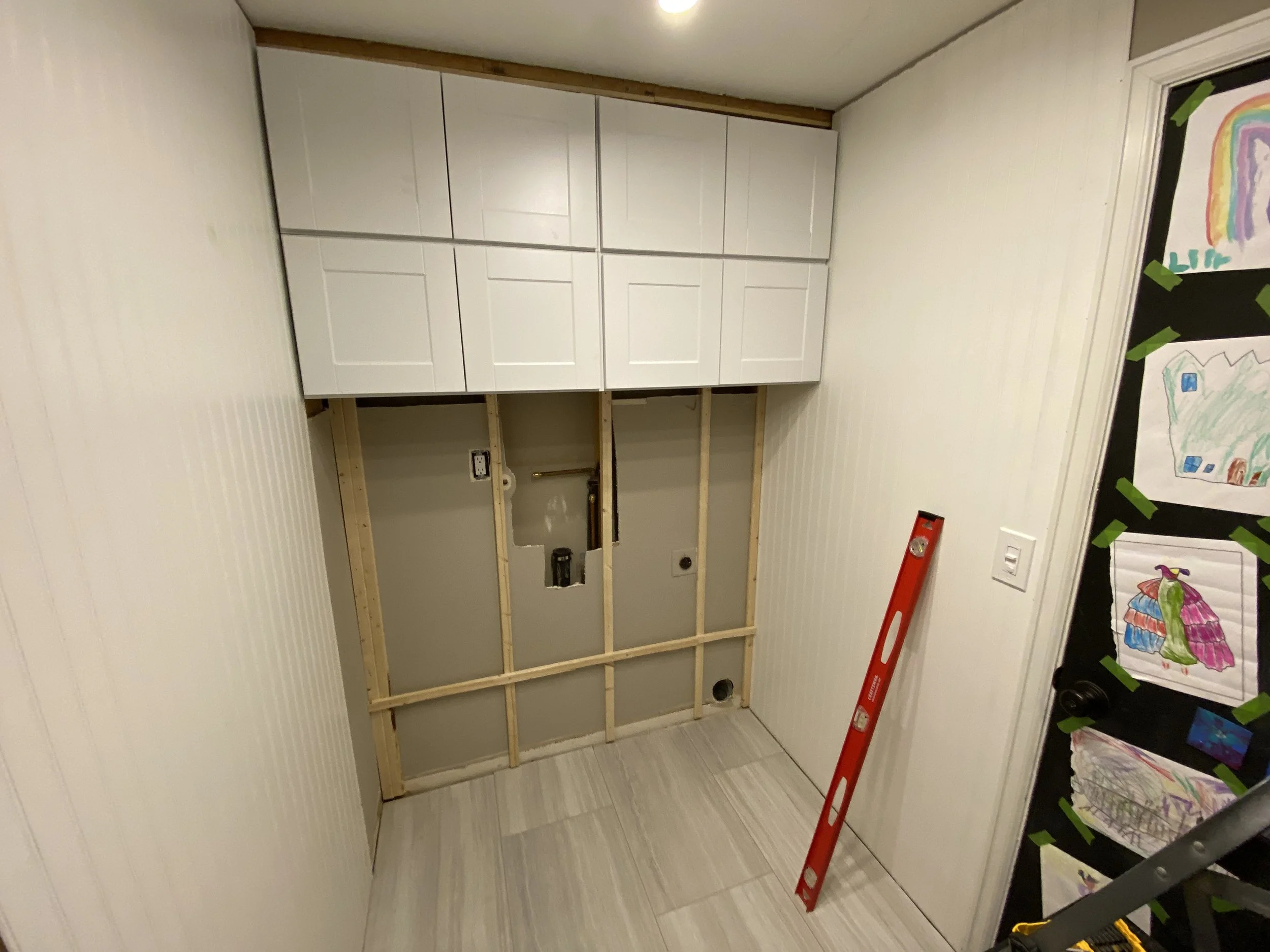And then got busy hanging the cabinets! It had been about a decade since I'd hung cabinets... I figured this would be a good reminder of how to do that, since my next big project is our kitchen. It's easier than I remember, so that was good.