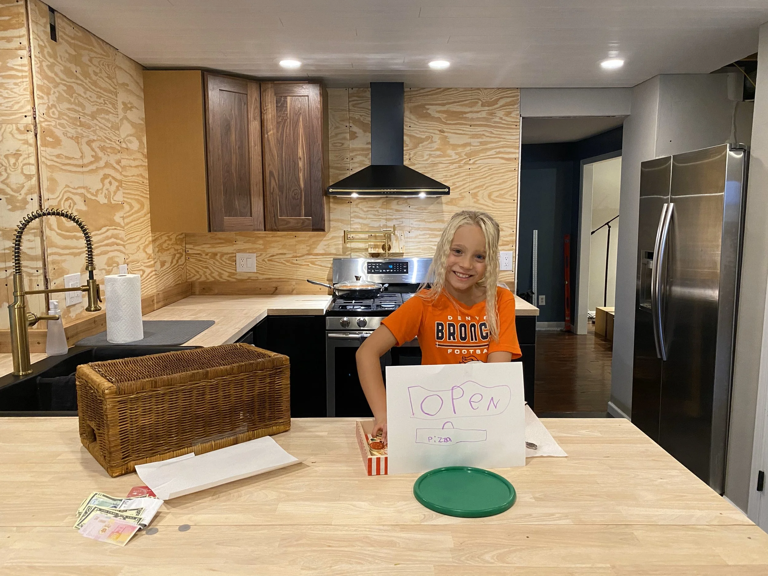 Taking a break, after a long and productive day, to play pizza shop with Lily. :)