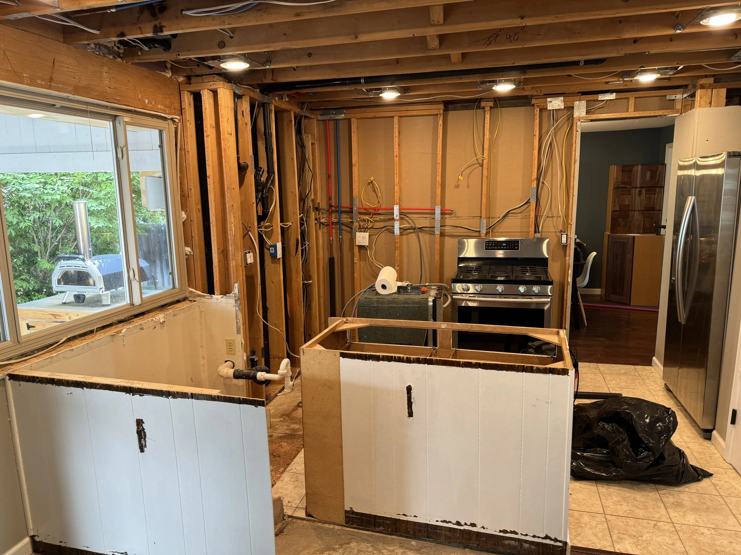 Base cabinets are coming out... Hooray!  Also installed recessed lighting in the ceiling.