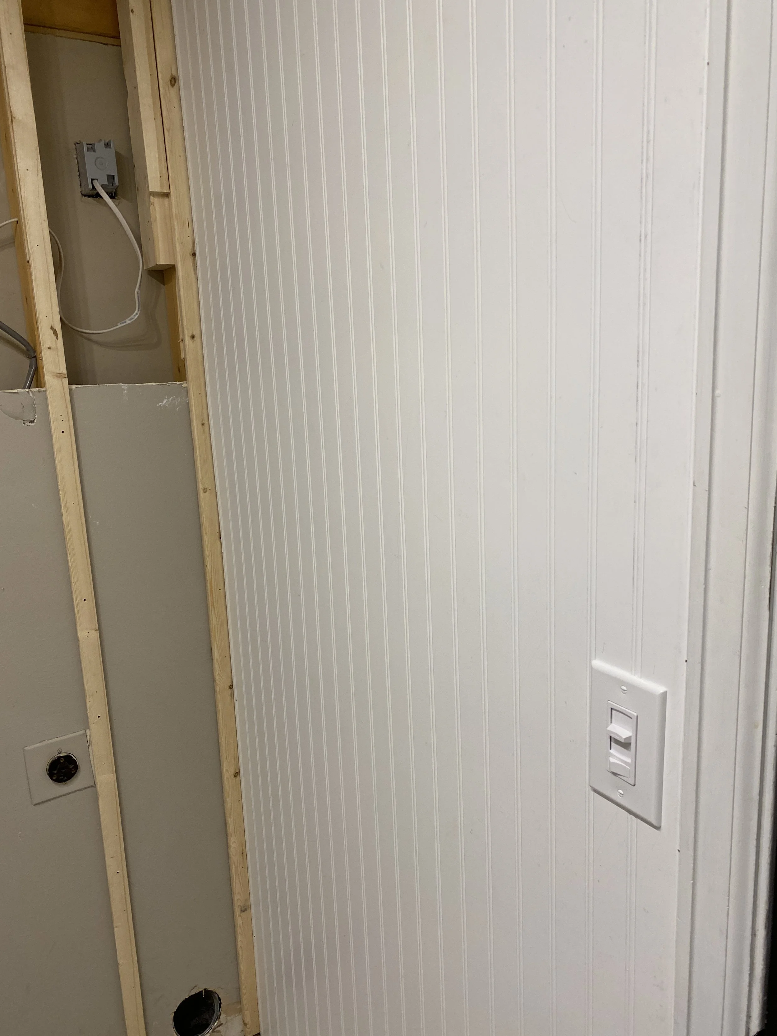 Added the wainscoting panels to the side walls, plus a new three-way dimmer switch.