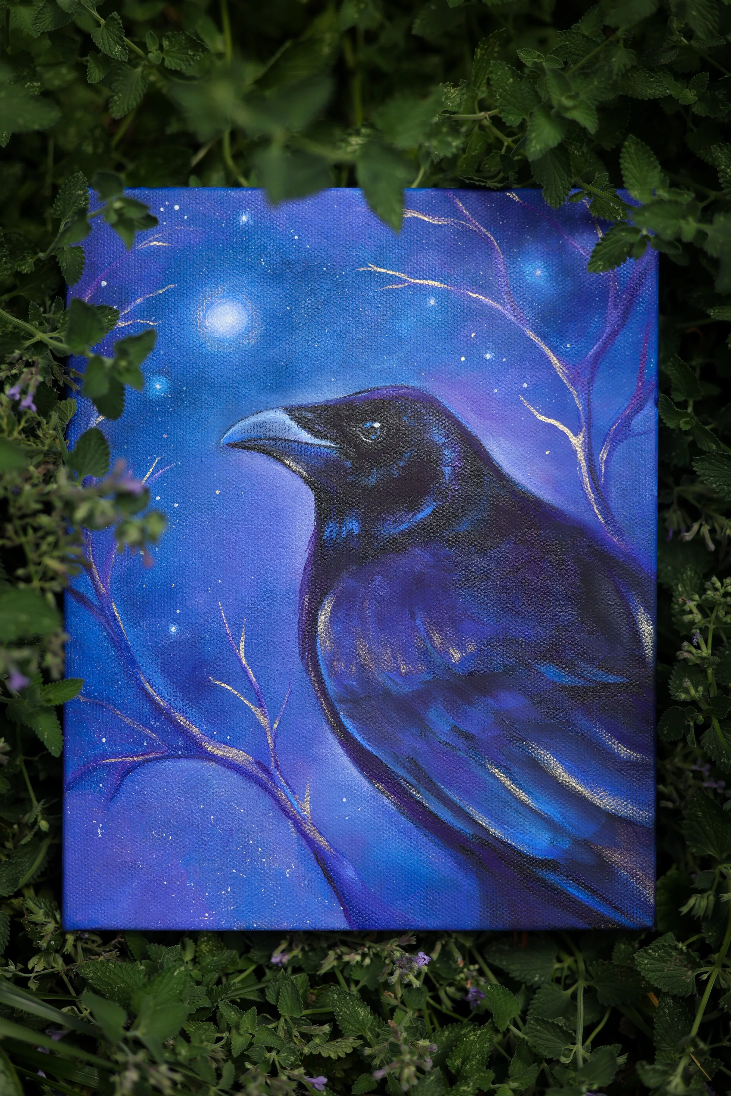 Crow art in blue and purple and black paint