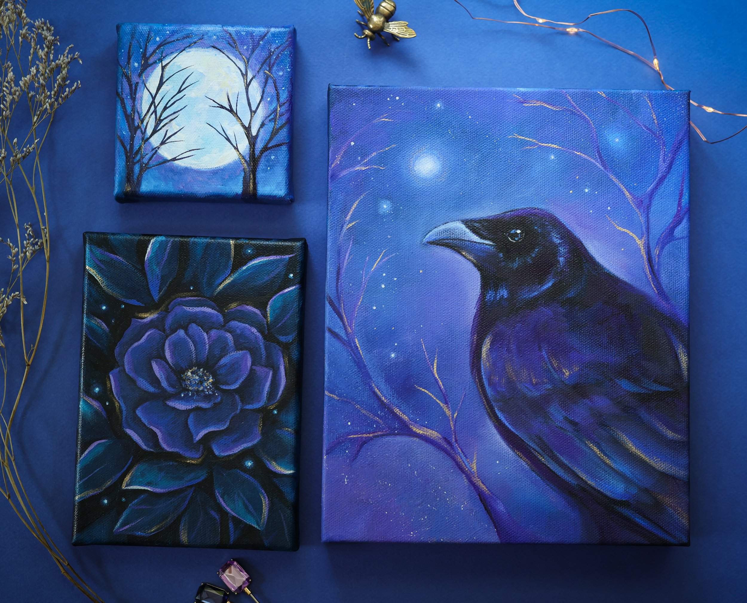 crow flower and moon oil paintings in blue and purple and black colors