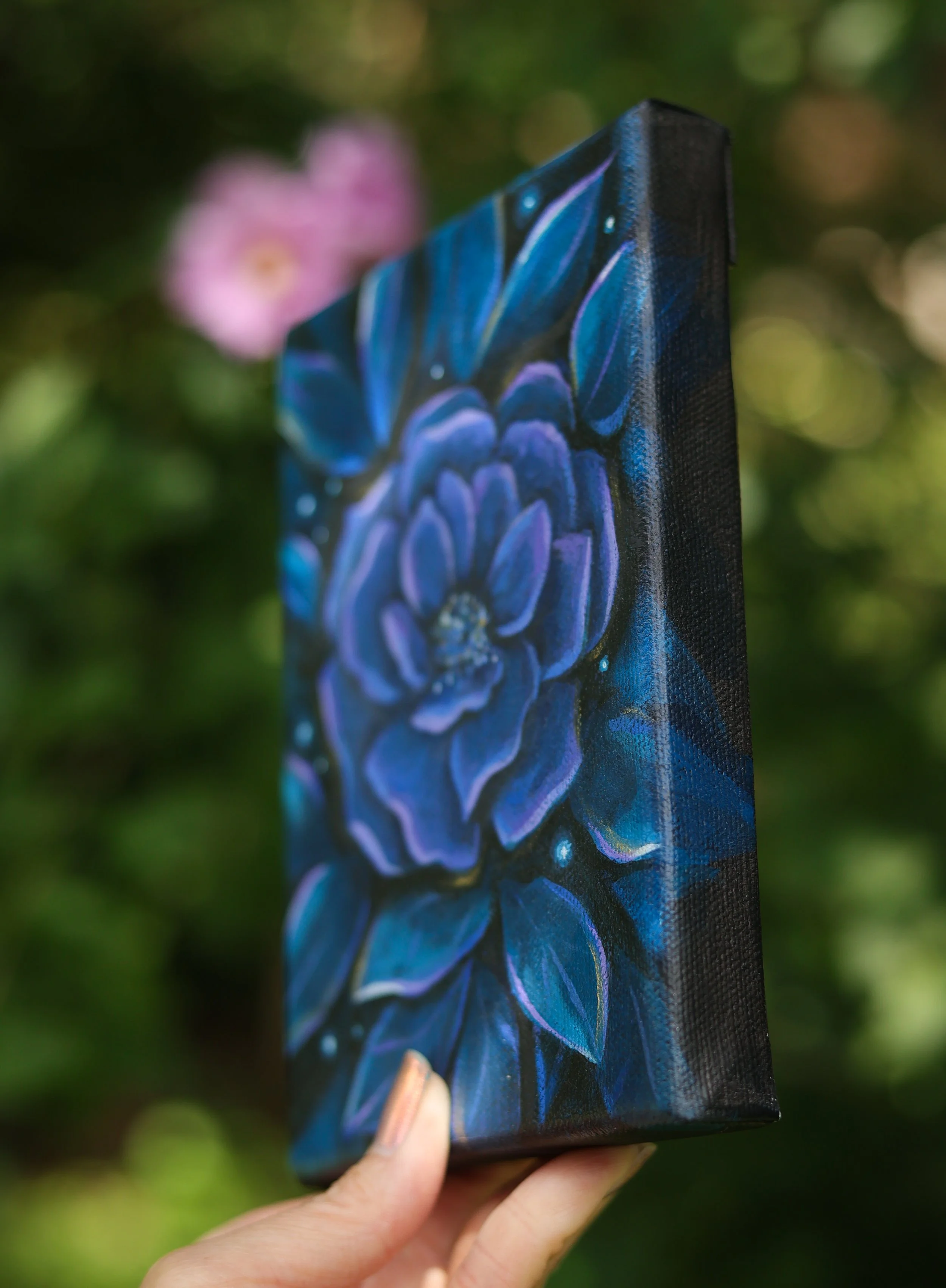 Rose art in purple and teal paints