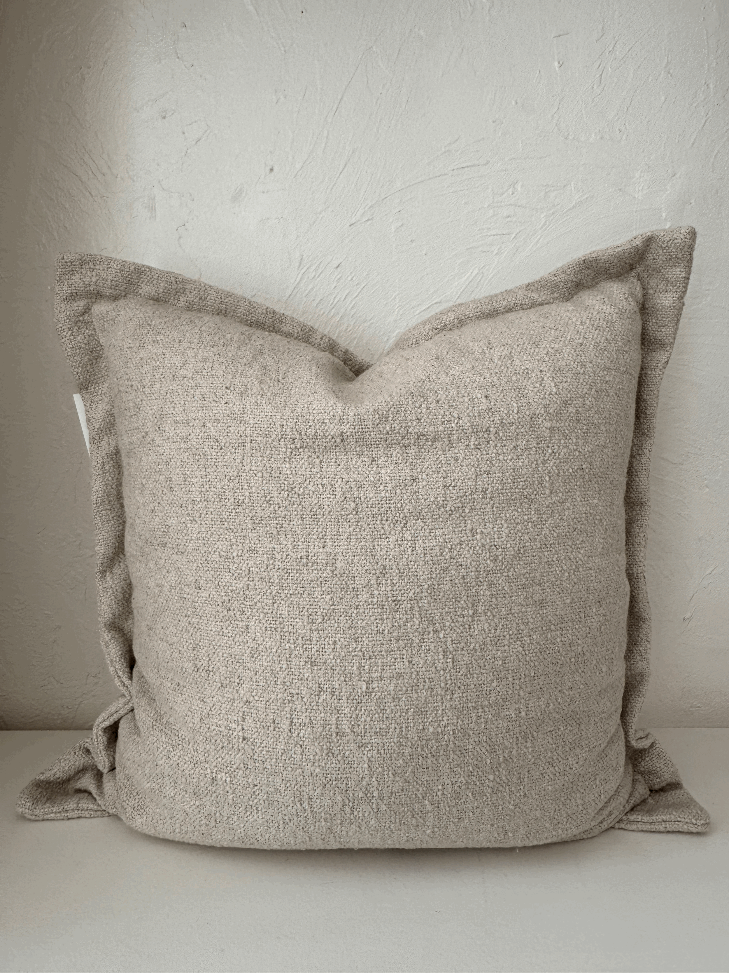 neutral textured throw pillow