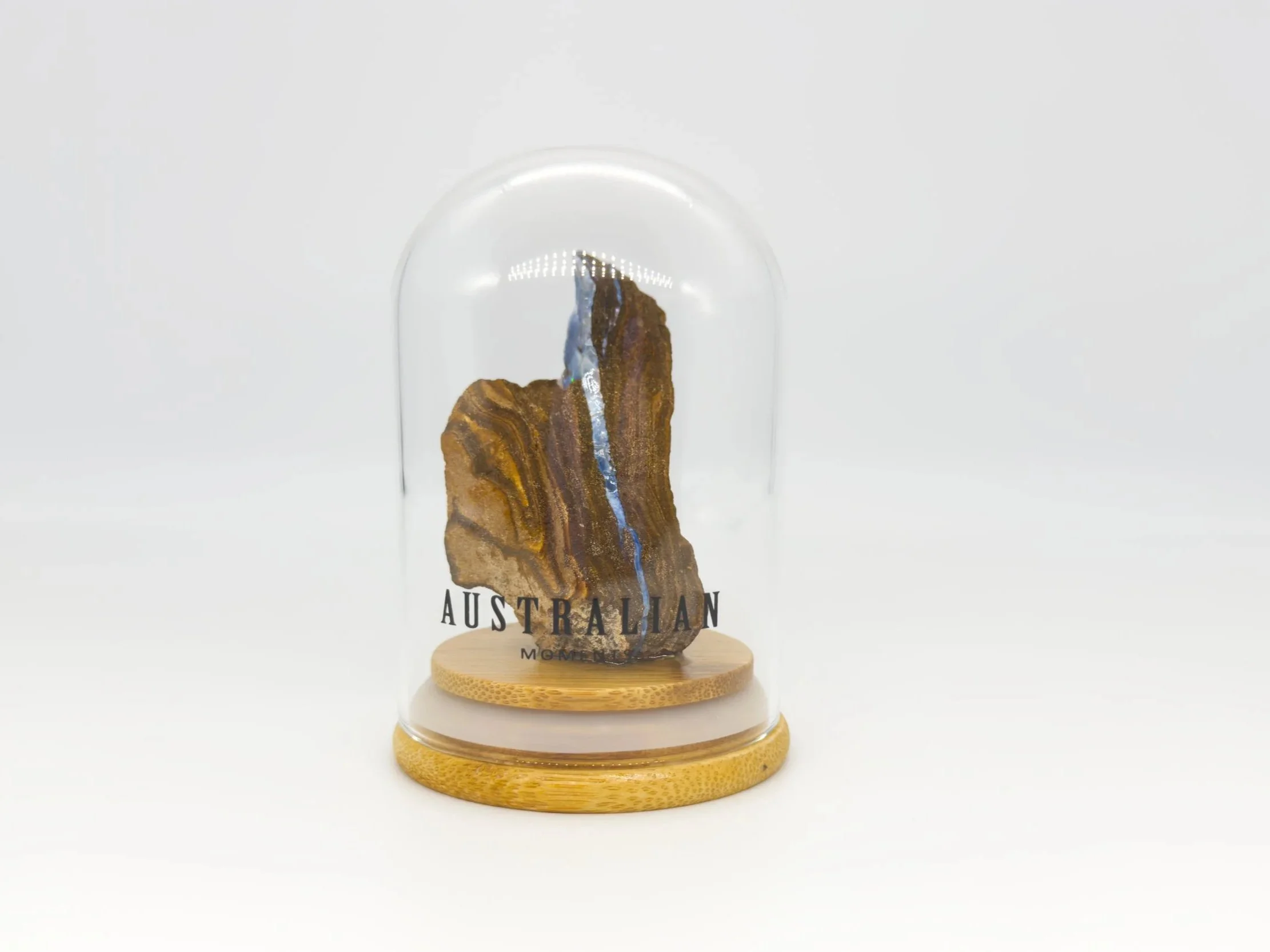 Boulder opal section in glass jar