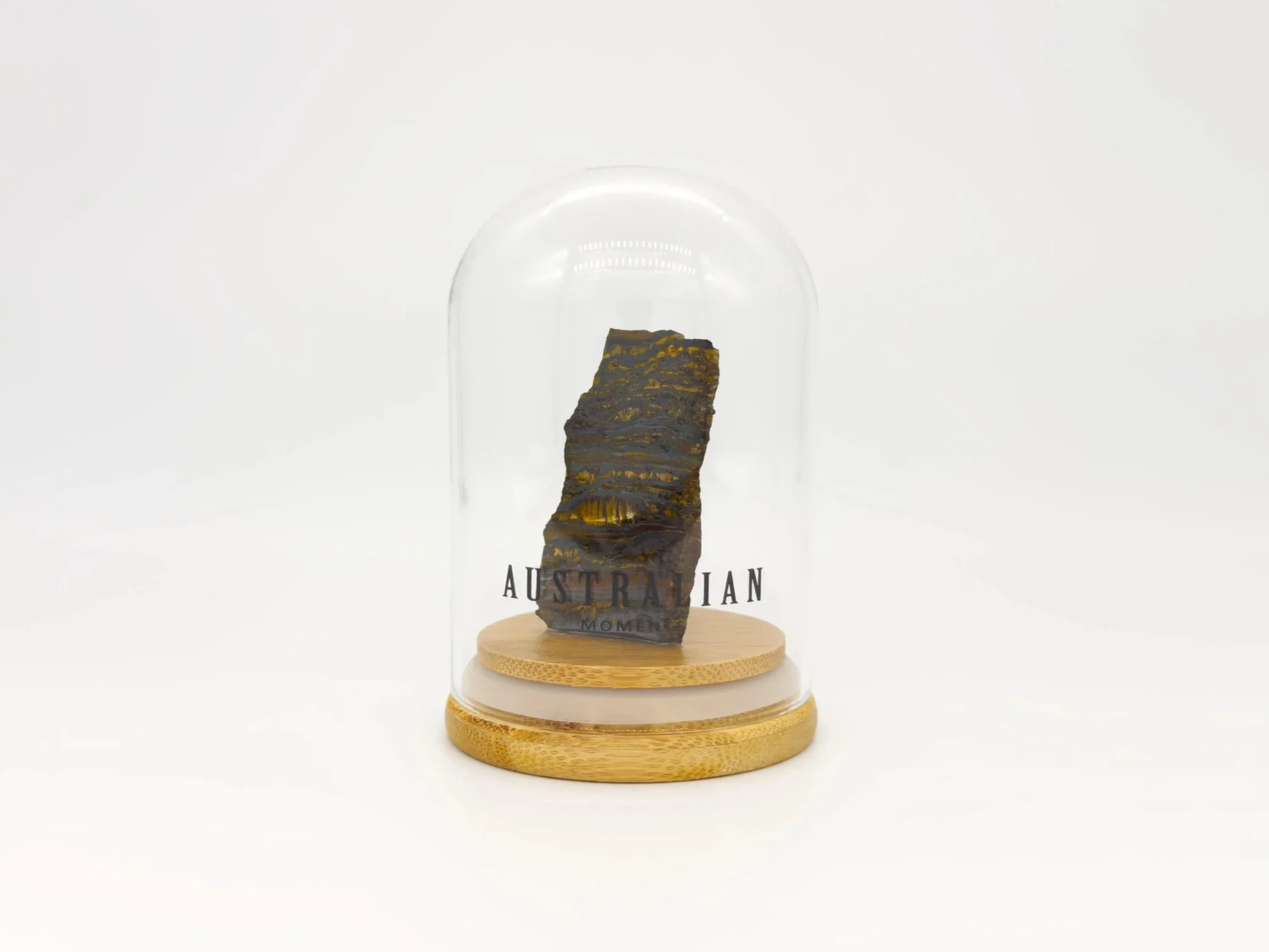 Banded tiger iron section in glass jar