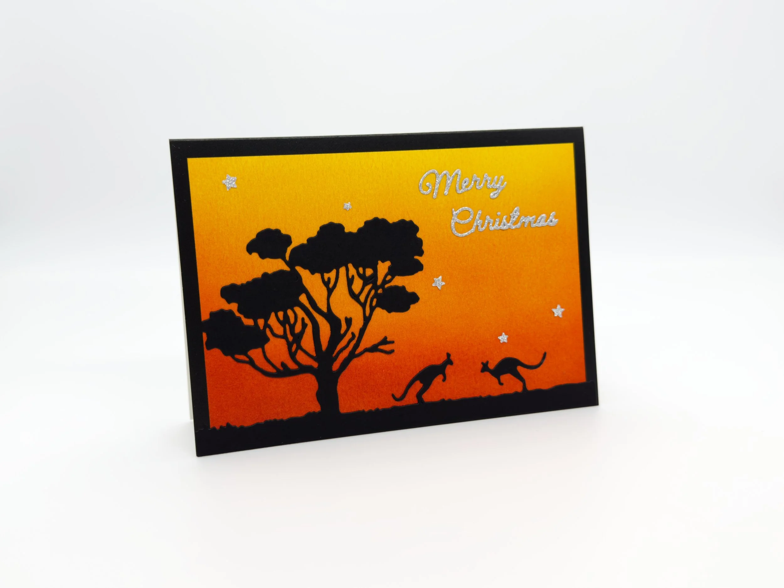 Two kangaroos at sunset christmas