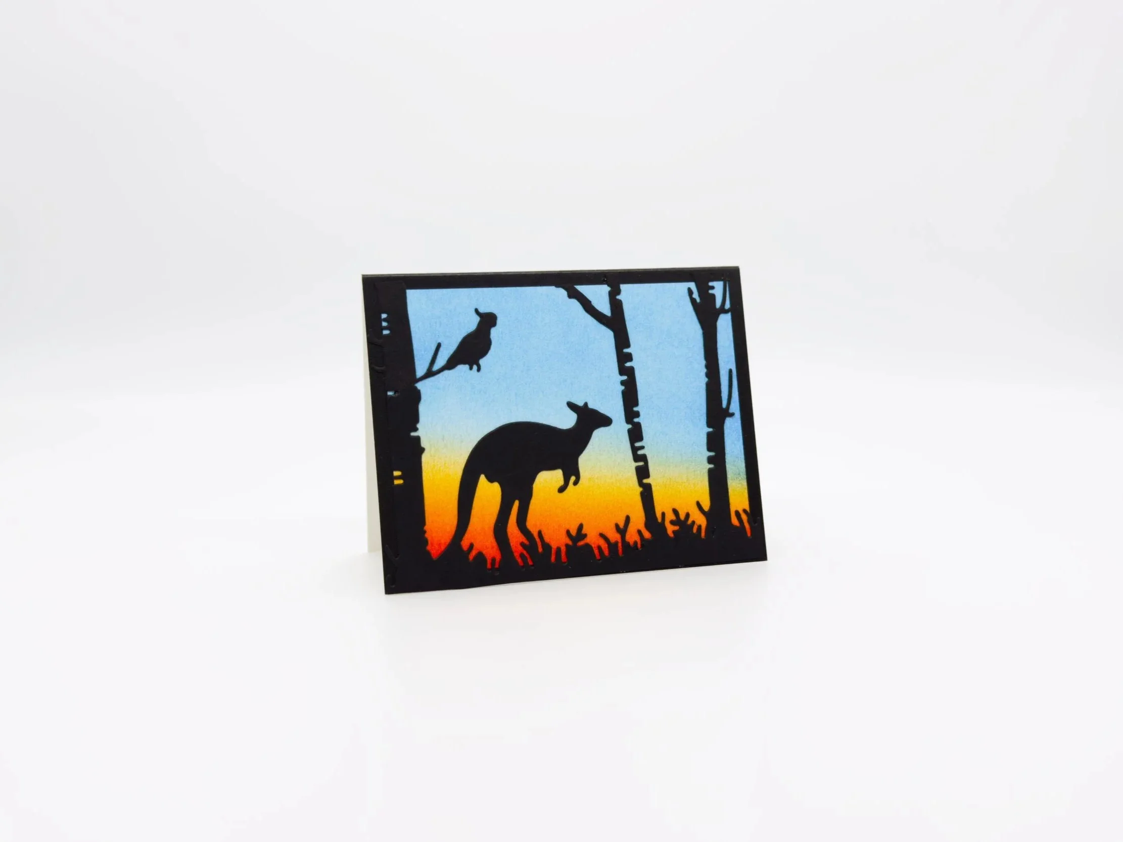 Kangaroo and cockatoo in trees