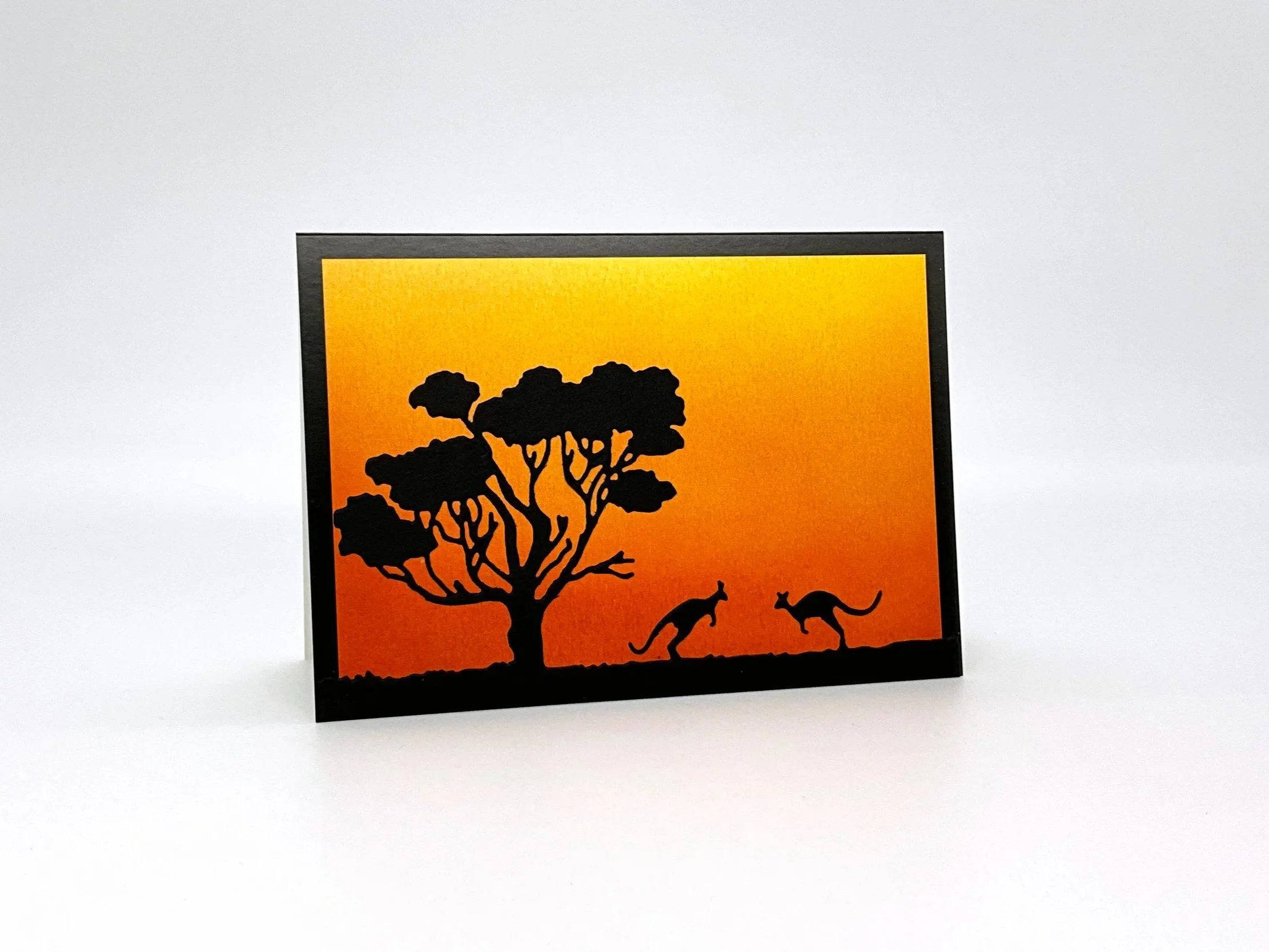 Two kangaroos at sunset