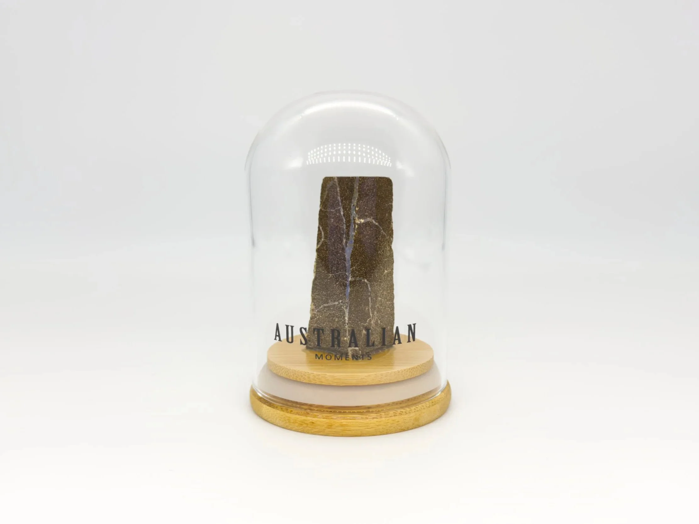 Boulder opal section in glass jar