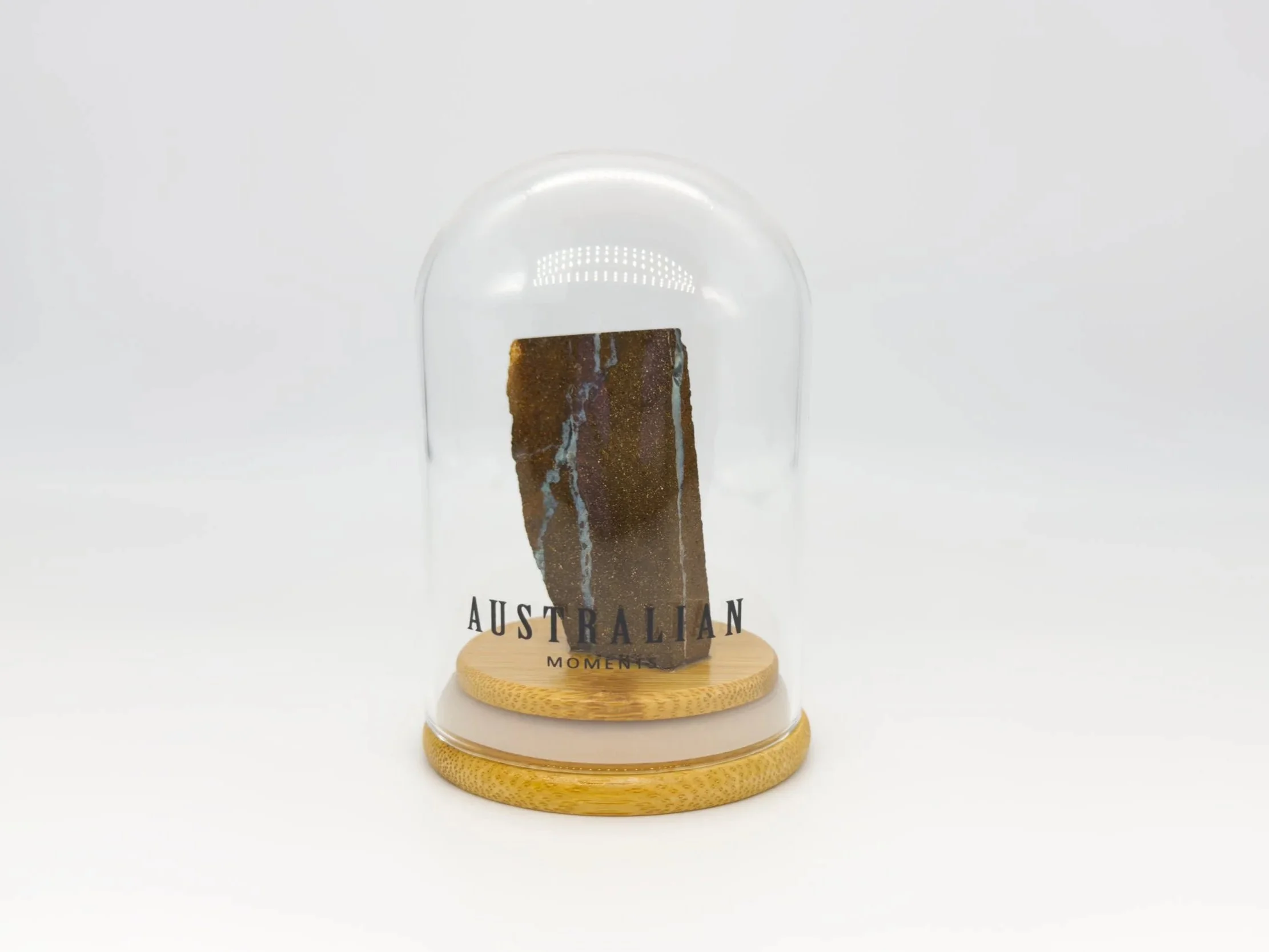 Boulder opal section in glass jar