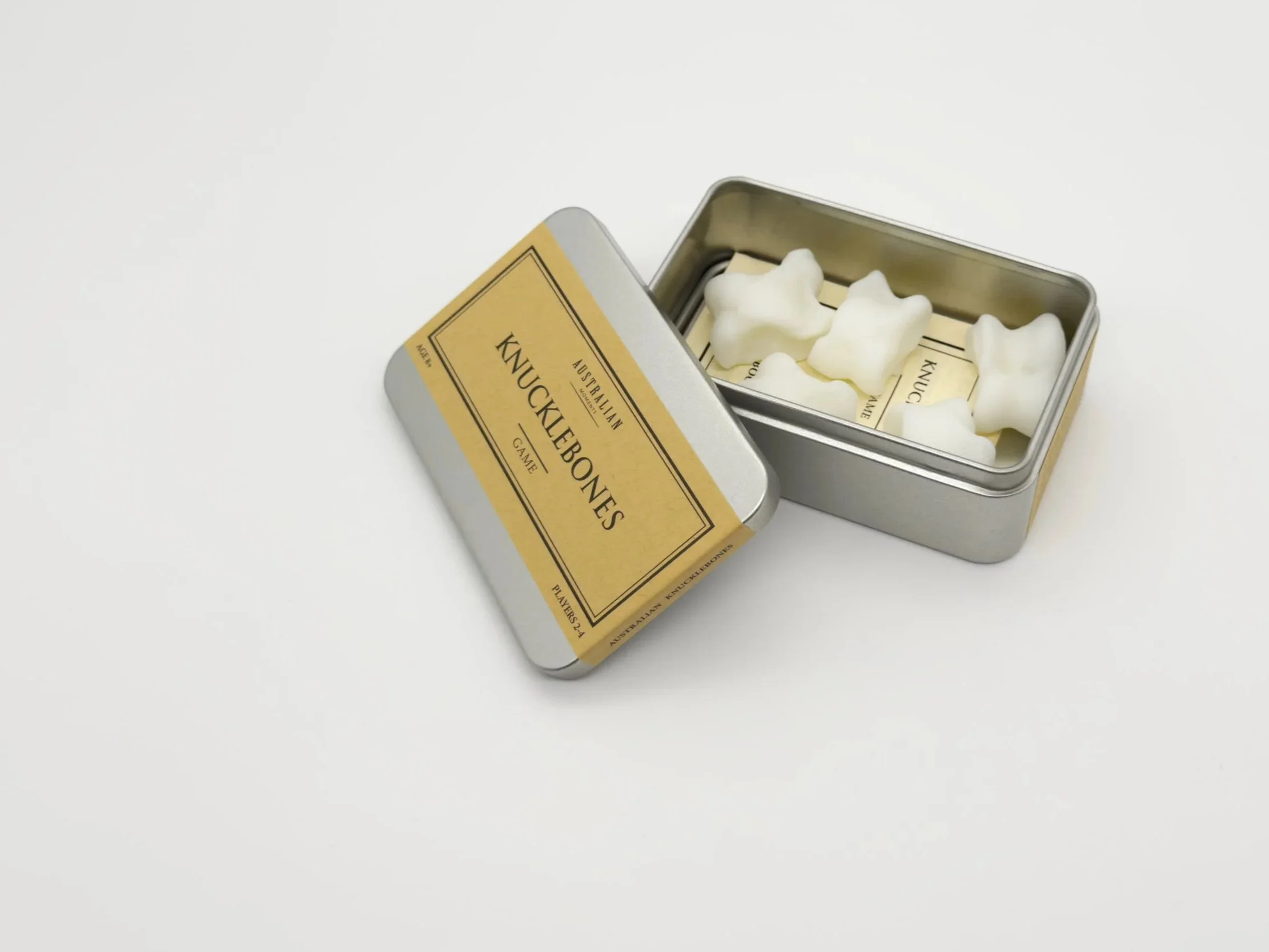 Sheep knucklebones in open tin