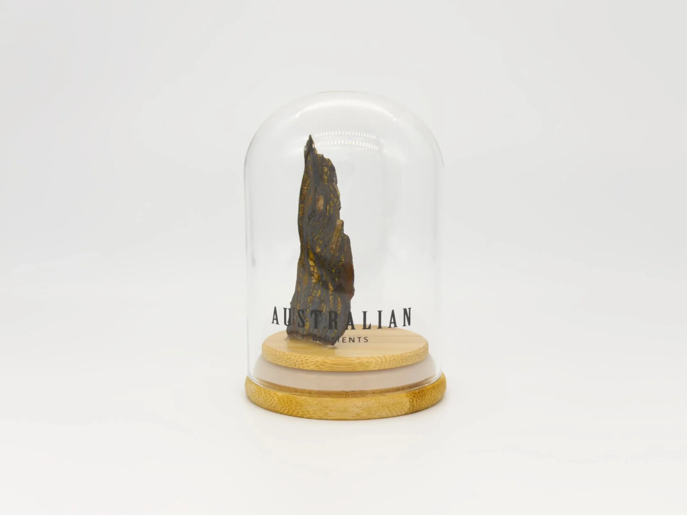 Banded tiger iron section in glass jar