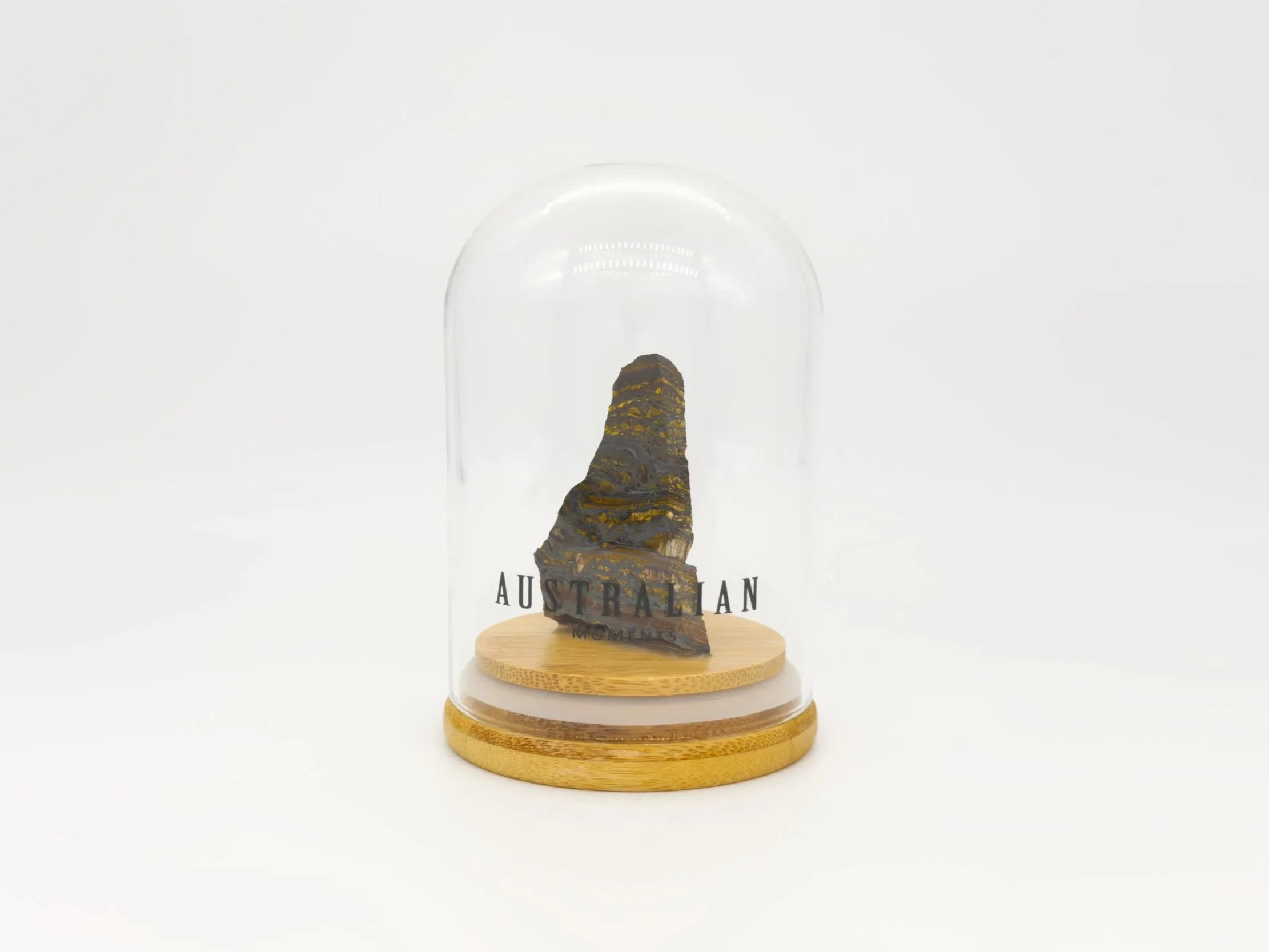 Banded tiger iron section in glass jar